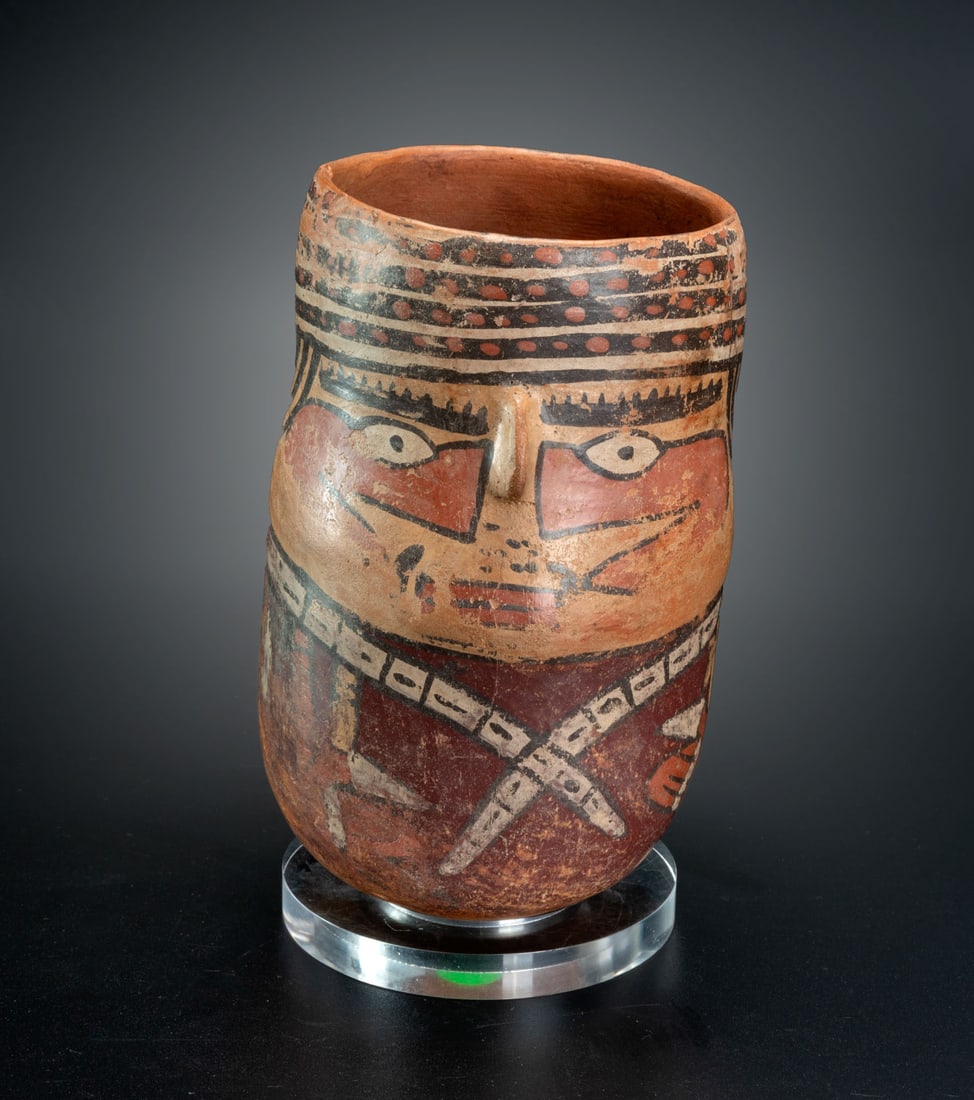 A Beaker with a Painted Male Figure, Middle Nasca, Peru, 200-300 CE: A Beaker with a Painted Male Figure, Middle Nasca, Peru, 200-300 CE Height: 18.1 cm For more details on this lot refer to the following number in the link: num 152, p.156 (