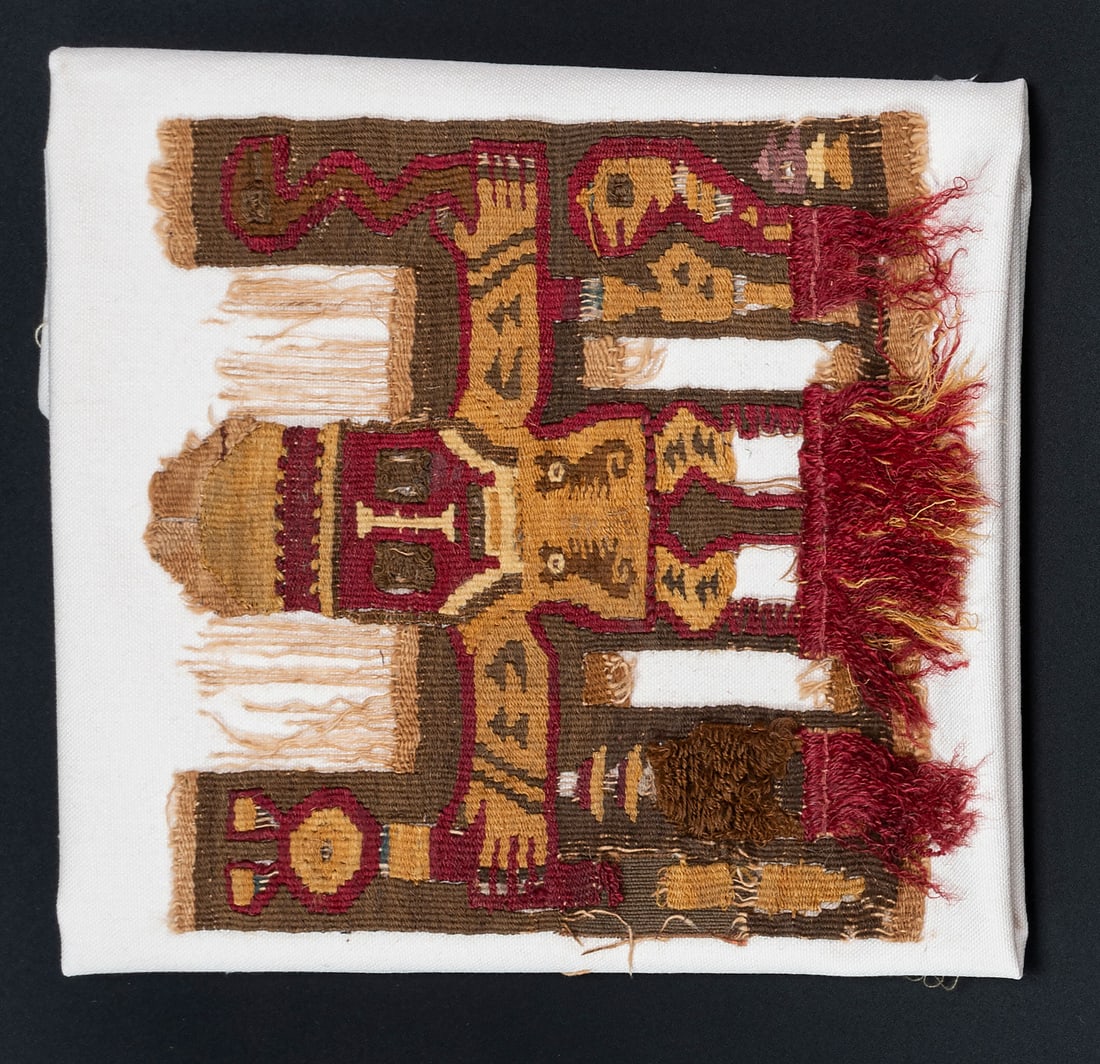 A Principal Deity - Applique, North Coast, Peru, Late Intermediate Period, 750-1350 CE: A Principal Deity - Applique, North Coast, Peru, Late Intermediate Period, 750-1350 CE Middle Lambayeque/Sican Multicolored camelid fiber slit tapestry, weft-looped pile. 17 x 16 cm For m