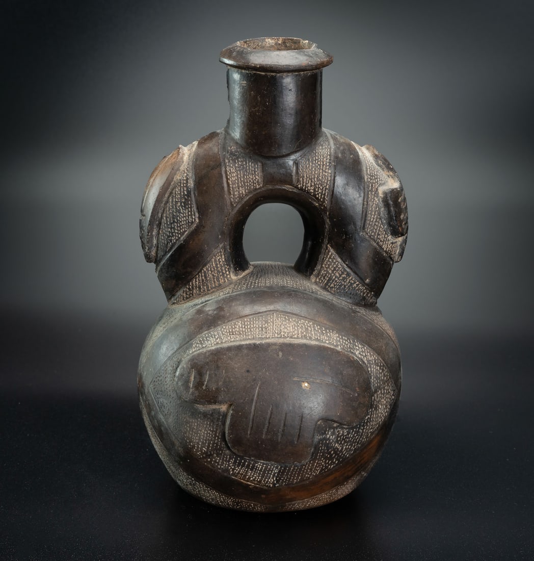 A Stirrup Spout Bottle Decorated with a Relief of a Deity Effigy, Chavin, Peru, 1200-200 BCE (1 of 4)