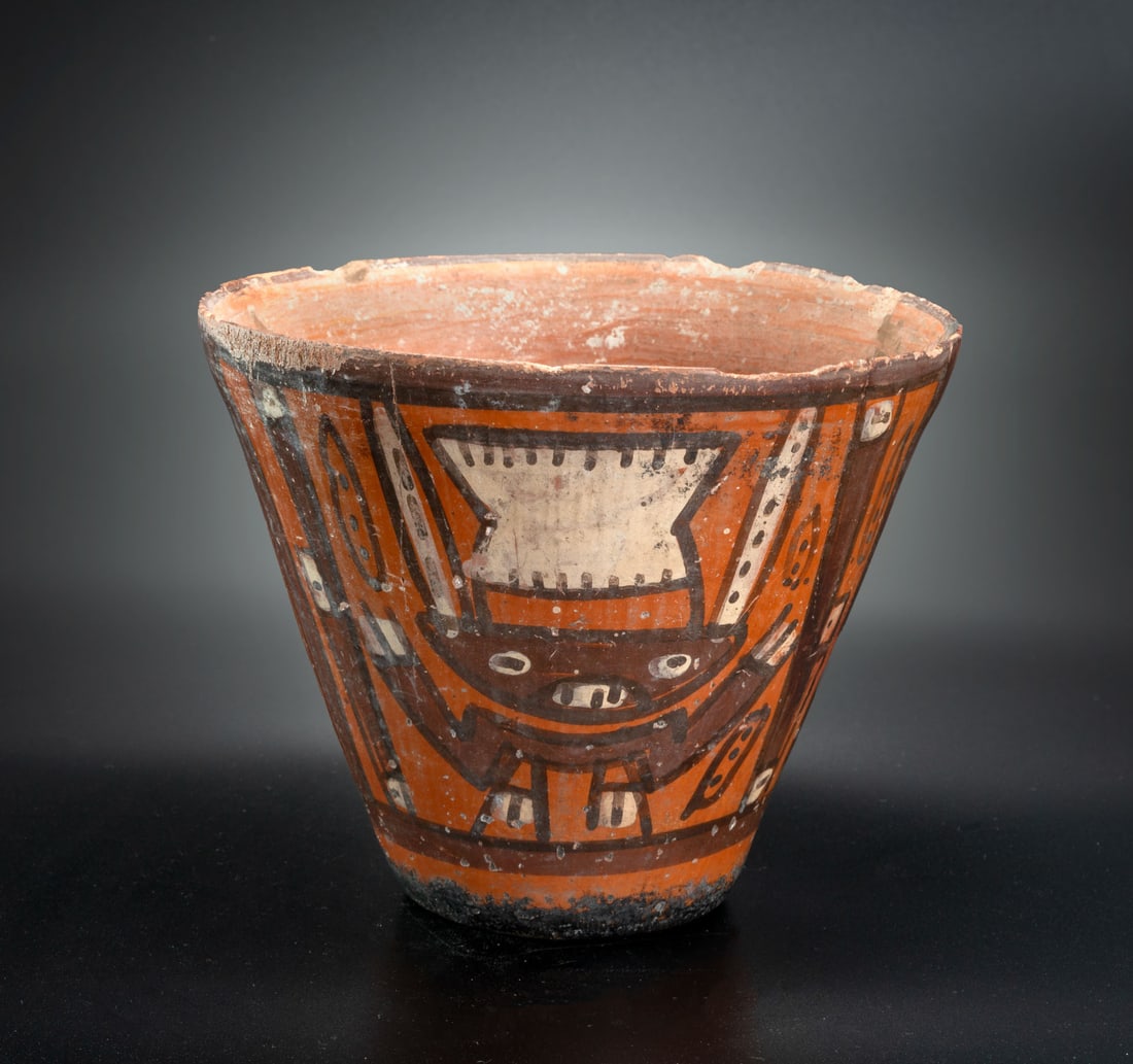 A Beaker with Painted Frontal Personages Holding Staffs, Huari-Related Local Style, 600-1100 CE: A Beaker with Painted Frontal Personages Holding Staffs, Huari-Related Local Style, 600-1100 CE Height: 13.3 cm For more details on this lot refer to the following number in the link: num 196, p. 161