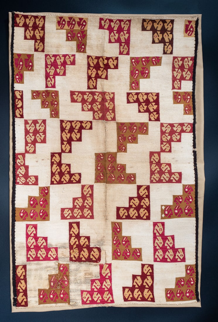 A Panel Fragment or Small Shirt with Step Triangles, North Coast, Peru, Late Horizon, 1350-1530 CE: A Panel Fragment or Small Shirt with Step Triangles, North Coast, Peru, Late Horizon, 1350-1530 CE Chimu White cotton and multicolored slit tapestry. 69 x 43 cm Fo