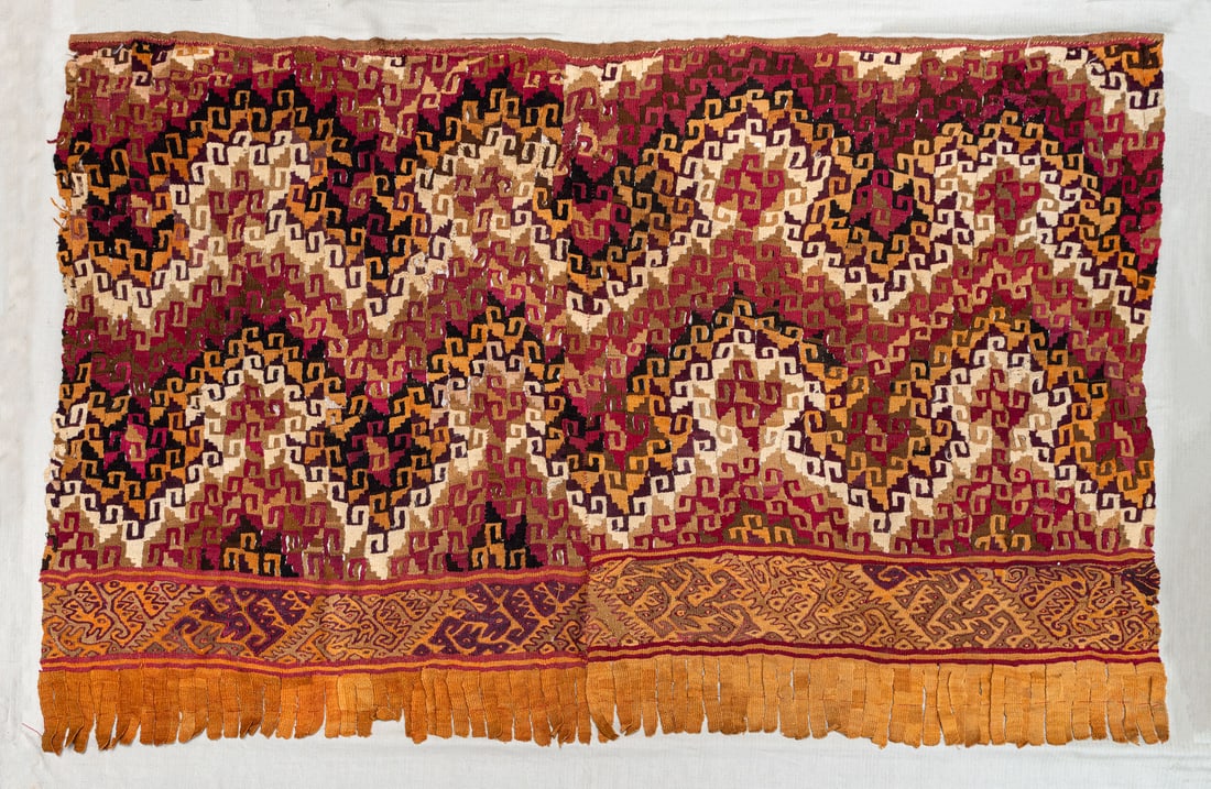 A Multicolored Mantle Covered with Step-Fret Symbols, Central/South Coast, Peru, Late Horizon,: A Multicolored Mantle Covered with Step-Fret Symbols, Central/South Coast, Peru, Late Horizon, 1100-1530 CE Local Style Cotton and multicolored camelid fiber slit tapestry with eccentric wefts. 70 x 1