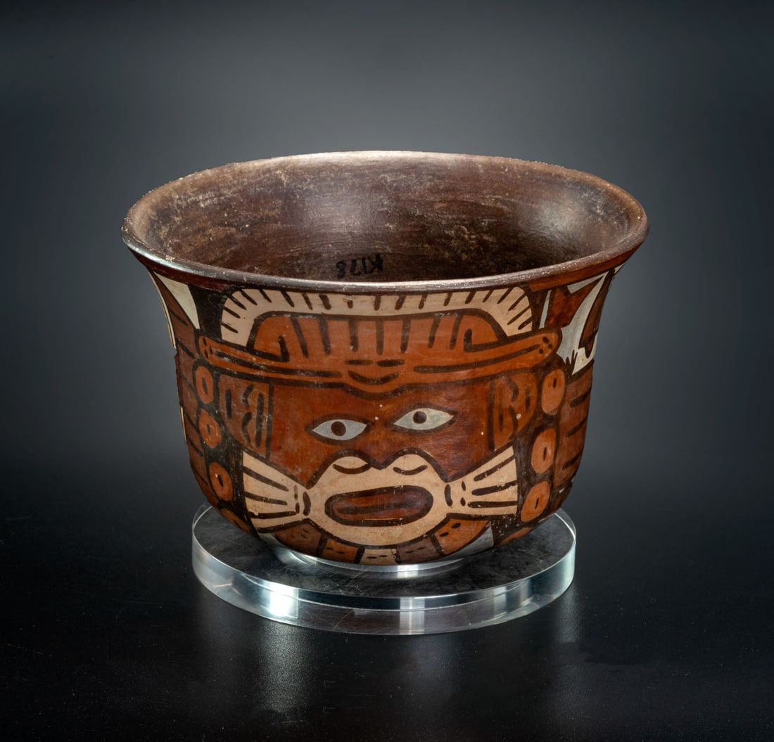 A Small Bowl Decorated with a Feline Whiskered Effigy, Middle Nasca, Peru, 100-300 CE: A Small Bowl Decorated with a Feline Whiskered Effigy, Middle Nasca, Peru, 100-300 CE Height: 8.5 cm Provenance: Kemper Collection, Switzerland. Donated to "The Museum of Islamic Art", Jerus