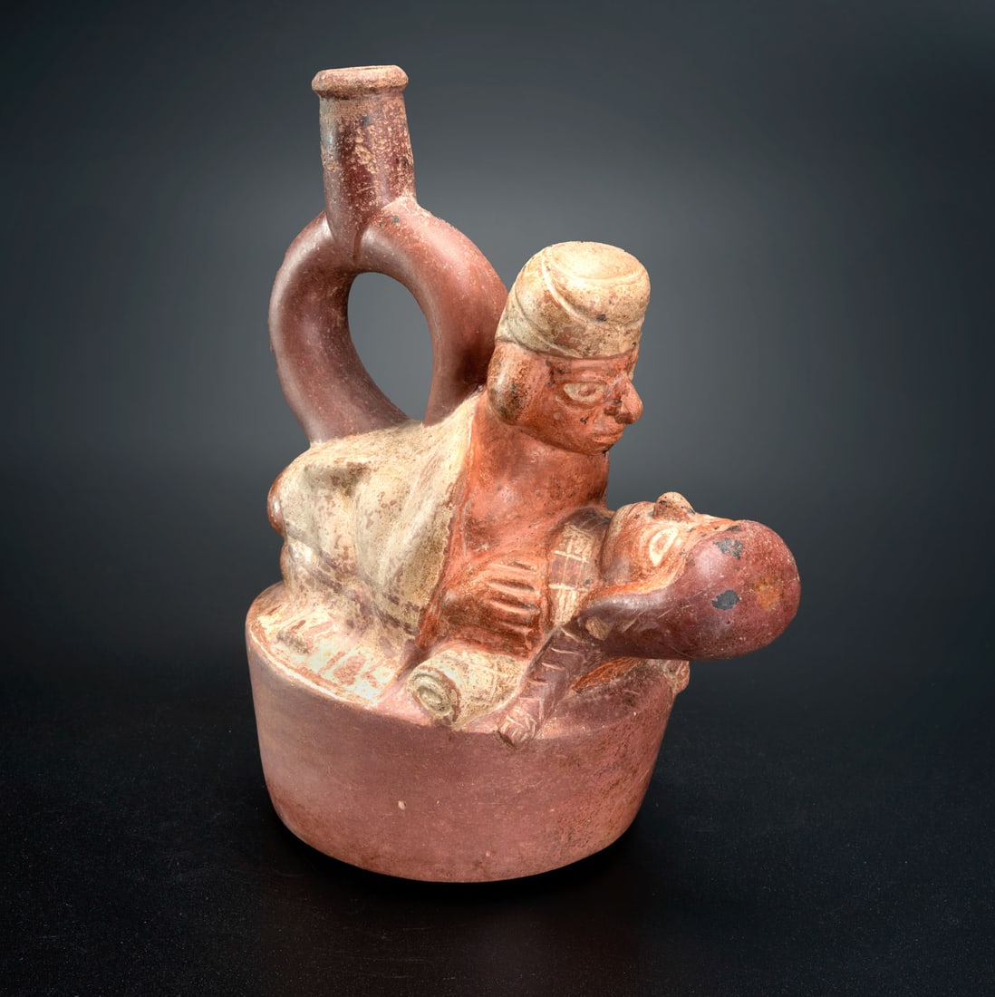 A Spout-and-Stirrup Effigy Bottle: Erotic Scene, Moche, Peru, 600-900 CE: A Spout-and-Stirrup Effigy Bottle: Erotic Scene, Moche, Peru, 600-900 CE Height: 19.5 cm Provenance: Jean Pierre Cottier and Fiorella Cottier-Angeli, Geneva, Switzerland. Purchased by Yossef Maiman be