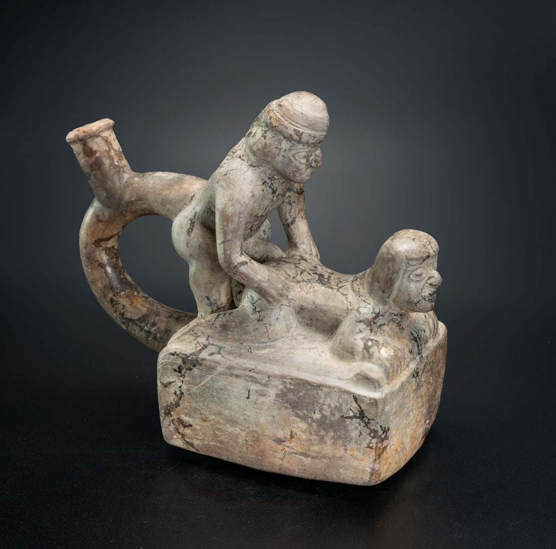 A Spout-and-Stirrup Effigy Bottle: Erotic Scene, Moche, Peru, 600-900 CE: A Spout-and-Stirrup Effigy Bottle: Erotic Scene, Moche, Peru, 600-900 CE Height: 18.3 cm Provenance: Jean Pierre Cottier and Fiorella Cottier-Angeli, Geneva, Switzerland. Purchased by Yossef Maiman be