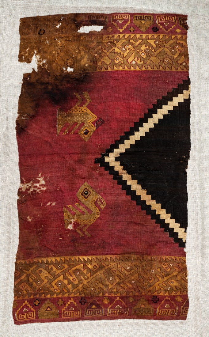A Half Shirt with Black Stepped Triangle, Central/South Coast, Peru, Late Horizon, 1450-1550 CE: A Half Shirt with Black Stepped Triangle, Central/South Coast, Peru, Late Horizon, 1450-1550 CE Local Style Multicolored camelid fiber slit tapestry with eccentric wefts. 78 x 45 cm 