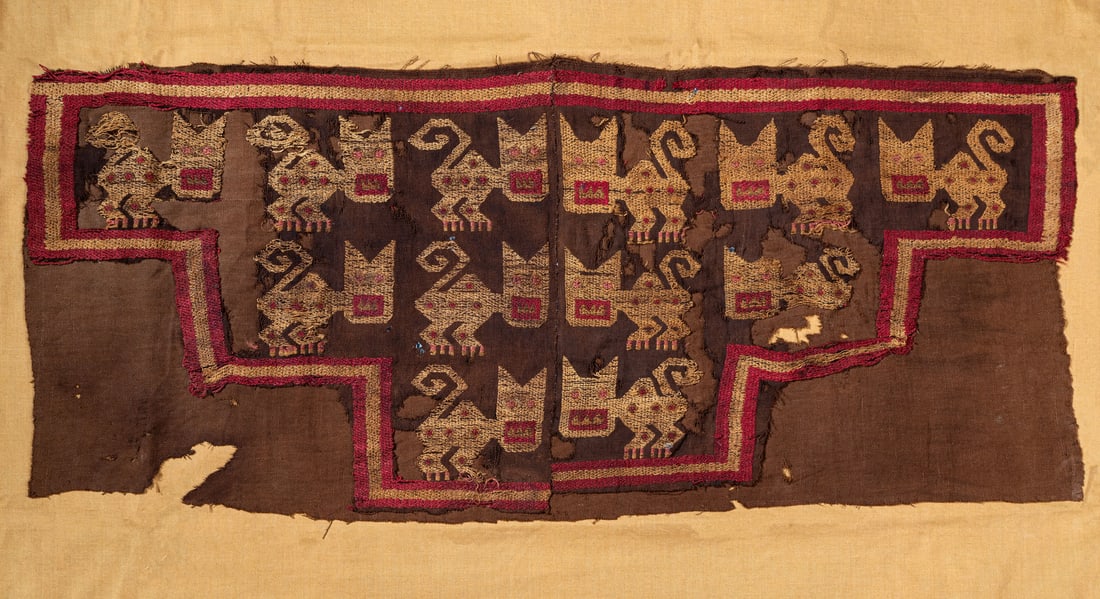 A Panel with Brocaded Cats, South Coast, Peru, Late Horizon, 1450-1550 CE: A Panel with Brocaded Cats, South Coast, Peru, Late Horizon, 1450-1550 CE Chimu-influenced Nasca-Inca Dark brown cotton and multicolored camelid fiber plain weave with supplementary wefts resembling t