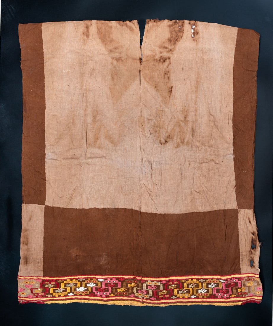 A Shirt with Brocaded Zoomorphic Motifs, South Coast, Peru, Late Horizon, 1450-1550 CE: A Shirt with Brocaded Zoomorphic Motifs, South Coast, Peru, Late Horizon, 1450-1550 CE Nasca-Inca Brown cotton and multicolored camelid fiber. The principle panel , plain weave warp face with suppleme