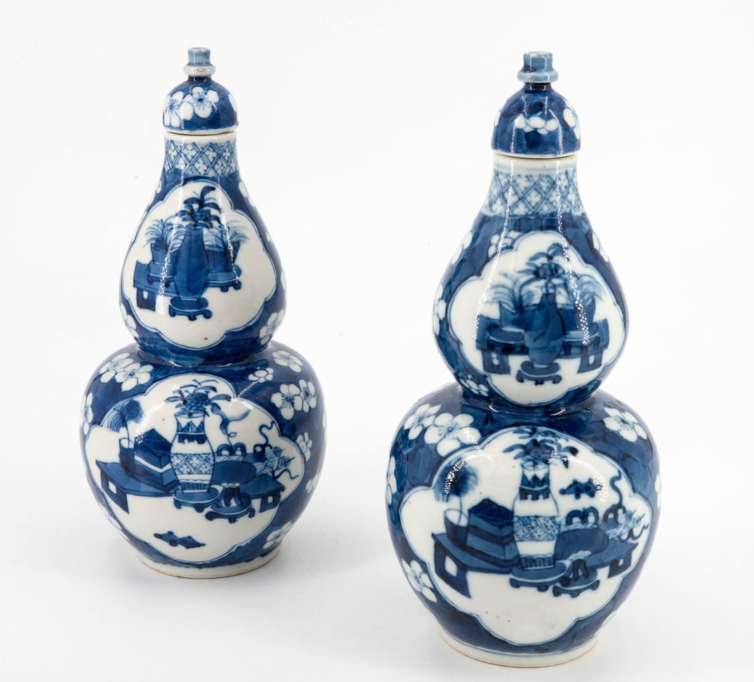A Fine Pair of Chinese Blue and White Double Guard Vases, Kangxi Mark and Period: A Fine Pair of Chinese Blue and White Double Guard Vases, Kangxi Mark and Period Bulbous body surmounted by a smaller bulbous neck and topped by a domed lid. Decorated in blue and white . Height: 22 c
