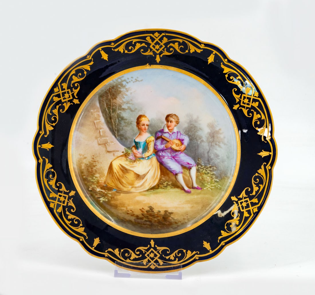 A Fine Sevres Polychrome Porcelain Cabinet Plate, France, 1844: A Fine Sevres Polychrome Porcelain Cabinet Plate, France, 1844 Centered with a hand painted with pastoral scene and the rims decorated with gilt scrolls on a cobalt blue ground. Fully marked. Diameter