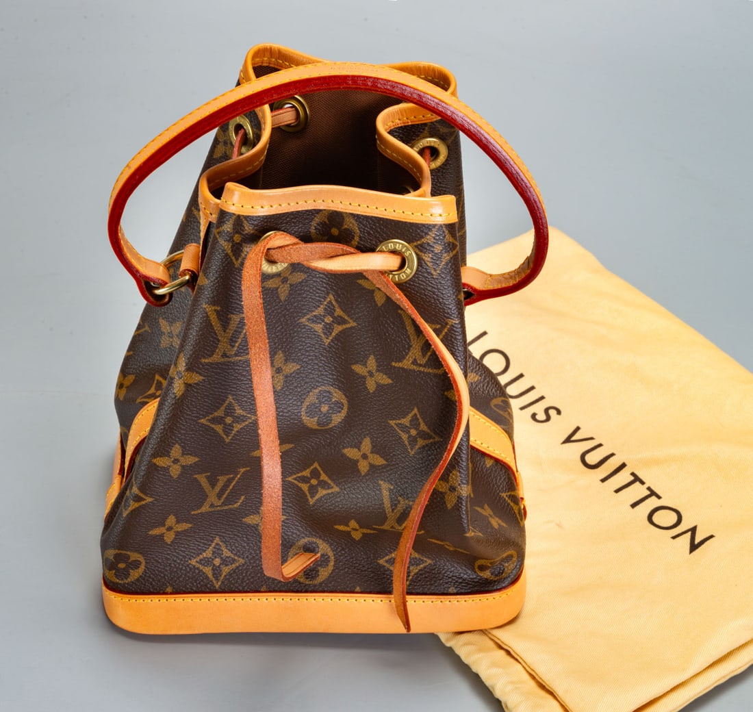 A Louis Vuitton Nano Noe Monogram Leather Shoulder Bag: A Louis Vuitton Nano Noe Monogram Leather Shoulder Bag Including the original sack. Length: 21 cm; width: 19 cm. Provenance: The Raymond collection, Tel Aviv. The owner was a manager of Louis Vuitton