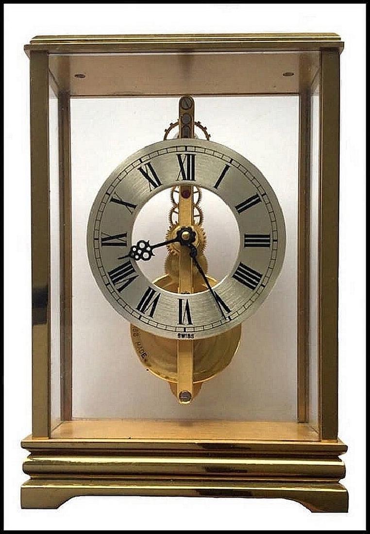 Jaeger Le coulter Swiss table clock, circa 1970, model: Jaeger Le coulter Swiss table clock, model number 817787173. Gilt metal frame, silver dial with Latin numbers. Marked and numbered on clock mechanism, front glass, and underneath the clock. Within its