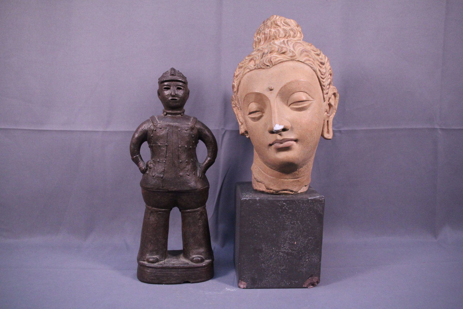 A resin buddha head and a man (1 of 6)