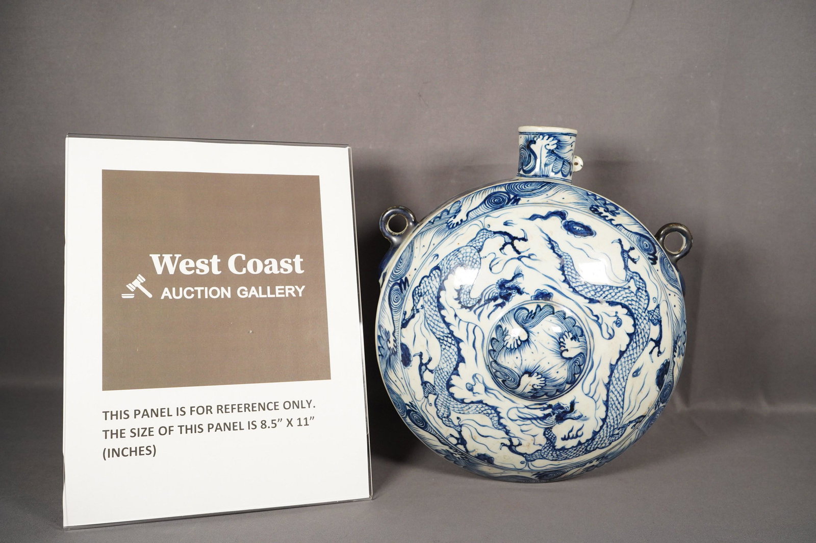 Chinese b/w porcelain wine flask: Chinese vintage blue and white porcelain wine flask, H: 10.5" x W: 9"Provenance: San Diego collector's estate.