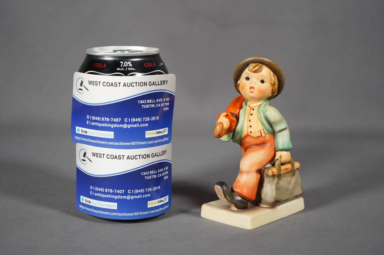 Hummel porcelain figure: A vintage Goebel Hummel, Germany little boy with suitcase figure. H: 5" x W: 3"