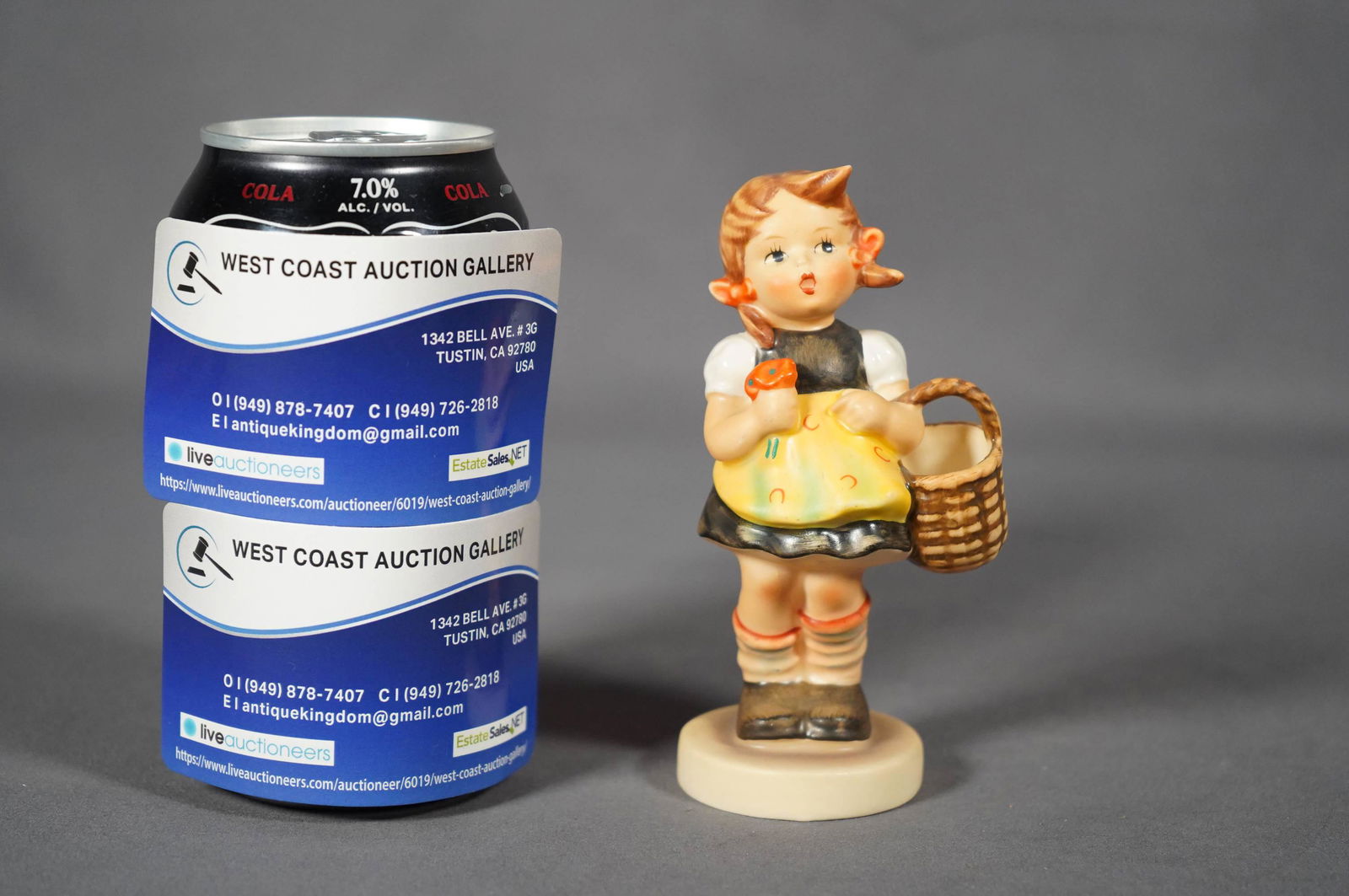 Hummel porcelain figure: A vintage Goebel Hummel, Germany, little girl with a basket. H: 4.5" x W: 2"