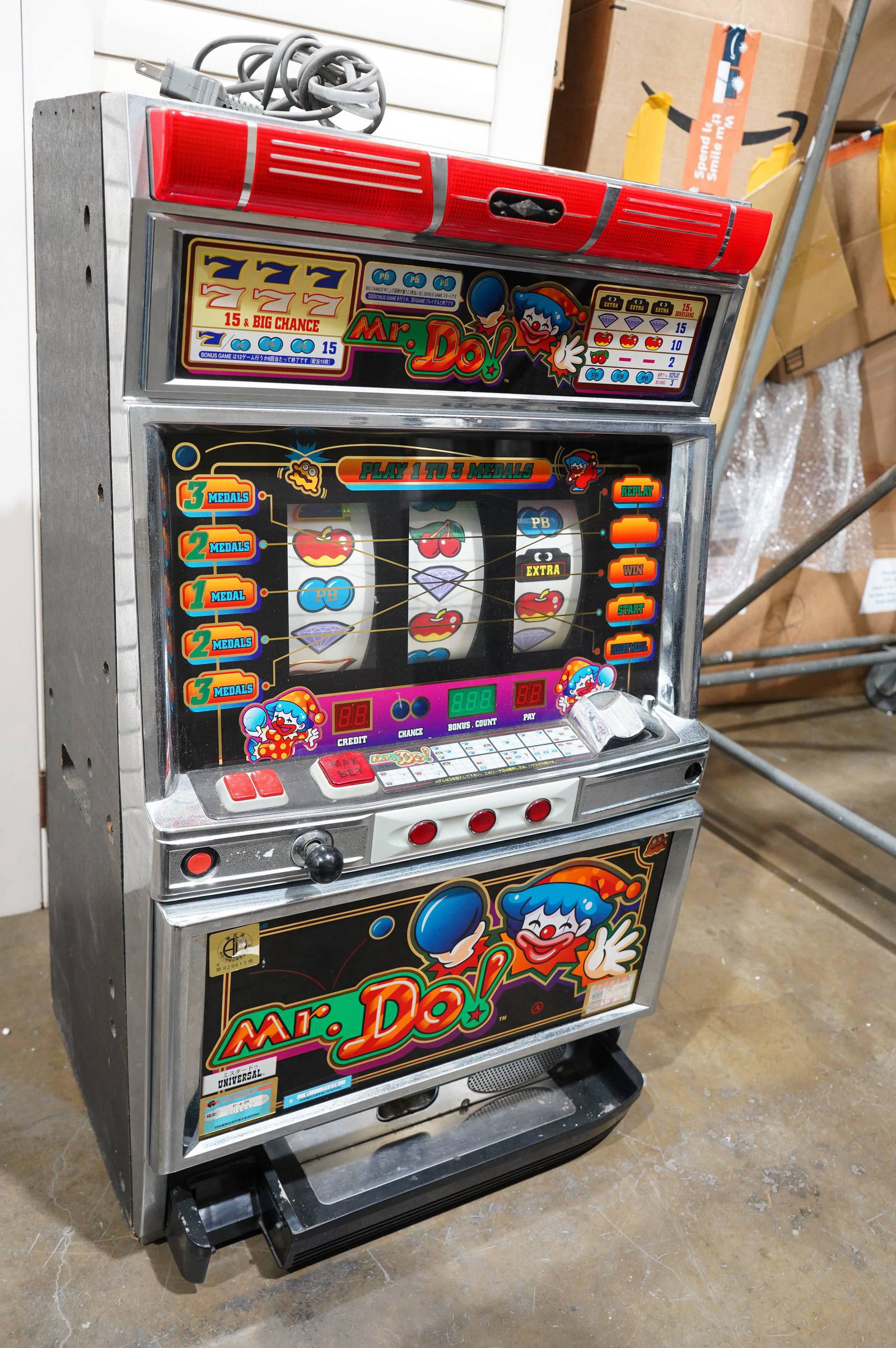 Mr. Do slot machine: A vintage Mr. Do themed slot machine. The condition is selling it as is,lights up, and have been tested. H: 33" x W: 19"