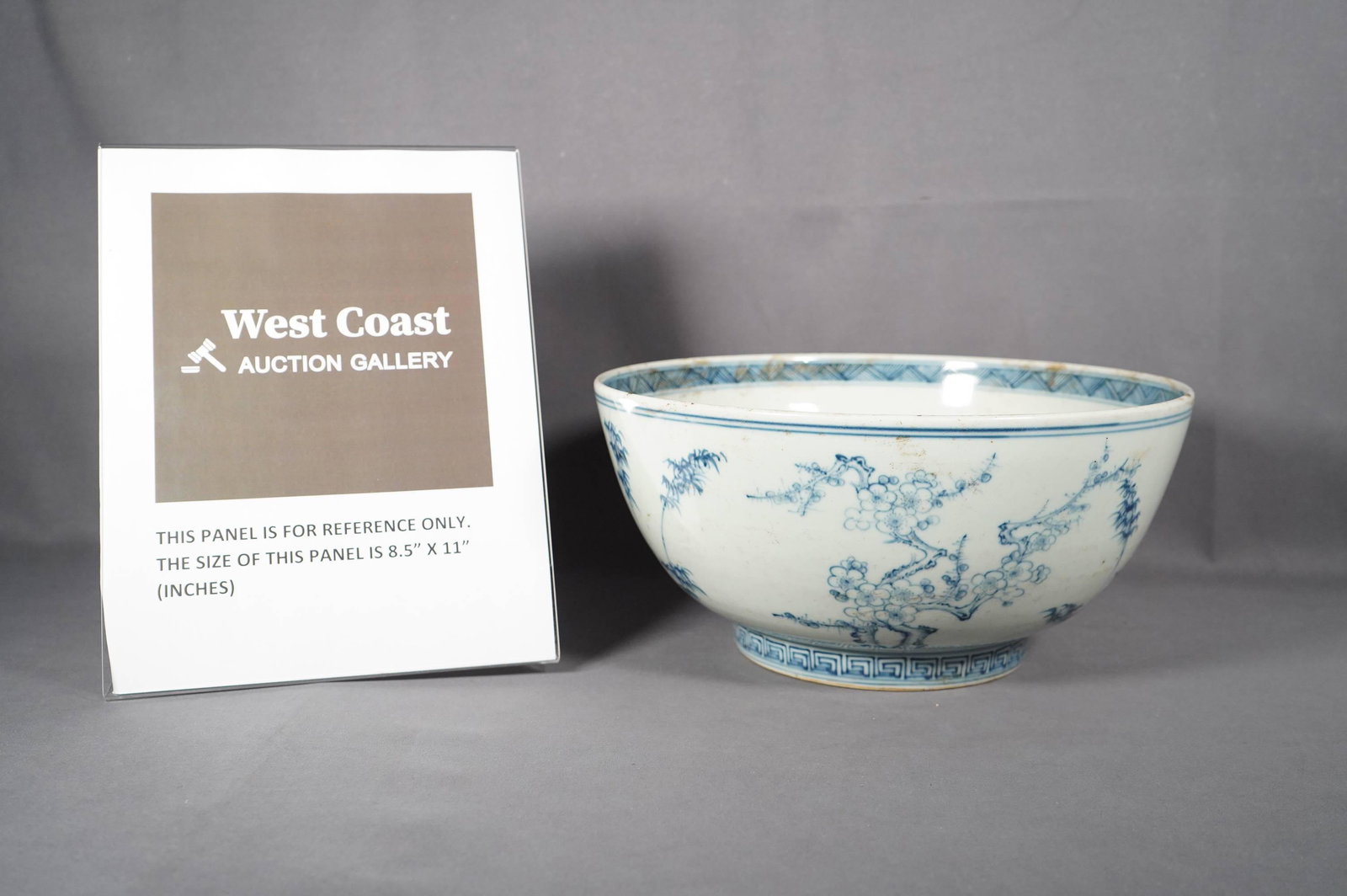 Chinese b/w porcelain bowl: Chinese blue and white porcelain bowl, top on the side of bowl, has minor wear. H: 6" x W: 12"