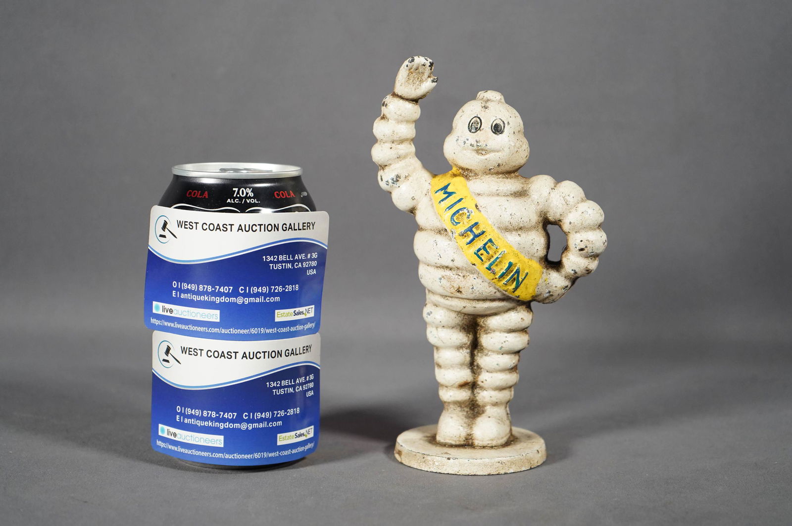 A cast iron bank: A vintage cast iron bank, in Michelin figure in standing form. H: 7" x W: 4"