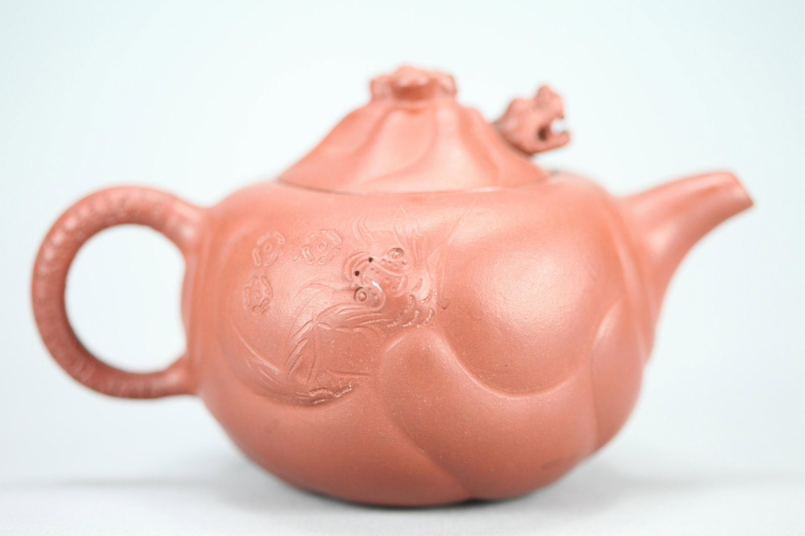 Chinese clay teapot: Chinese carved clay teapot. H: 3.75" x W: 6.5"