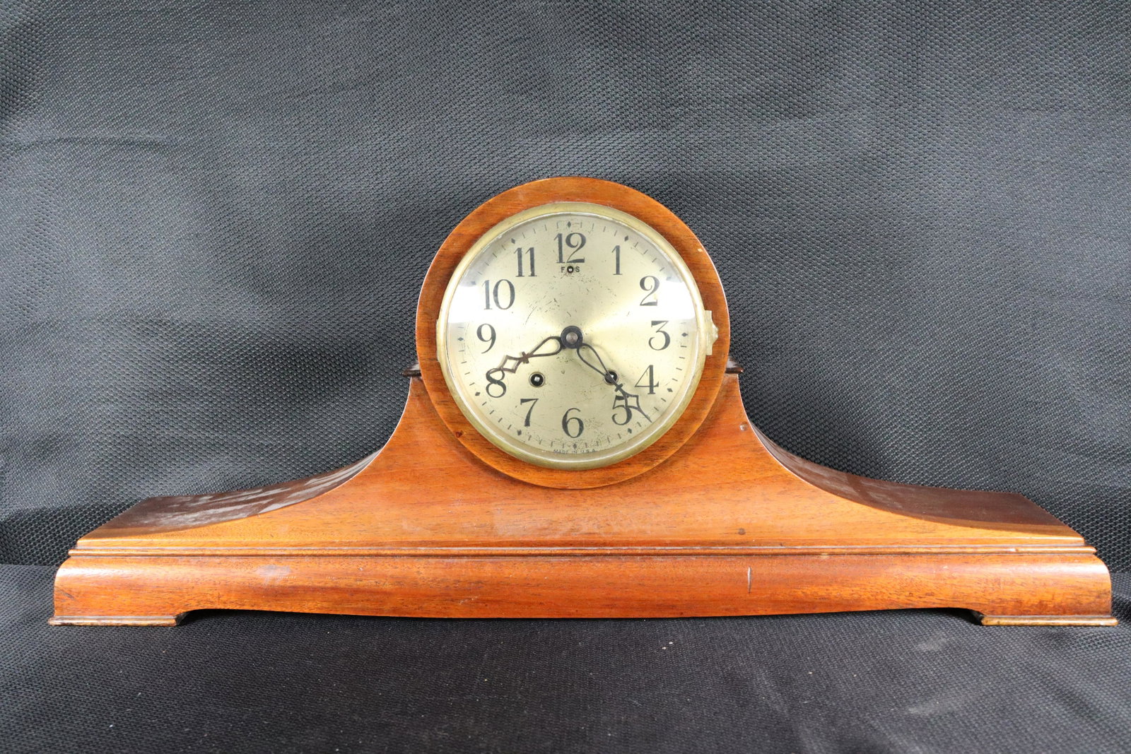 A wooden mantle clock: A wooden mantle clock, condition selling it as is. H: 12.5: x W: 28.75"
