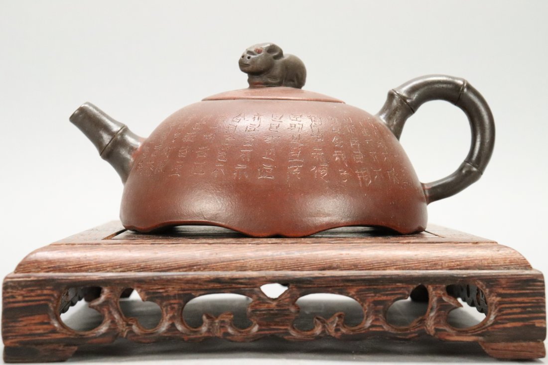 Chinese carved clay teapot: Chinese vintage carved inscription clay teapot. H: 3.25" x W: 7."