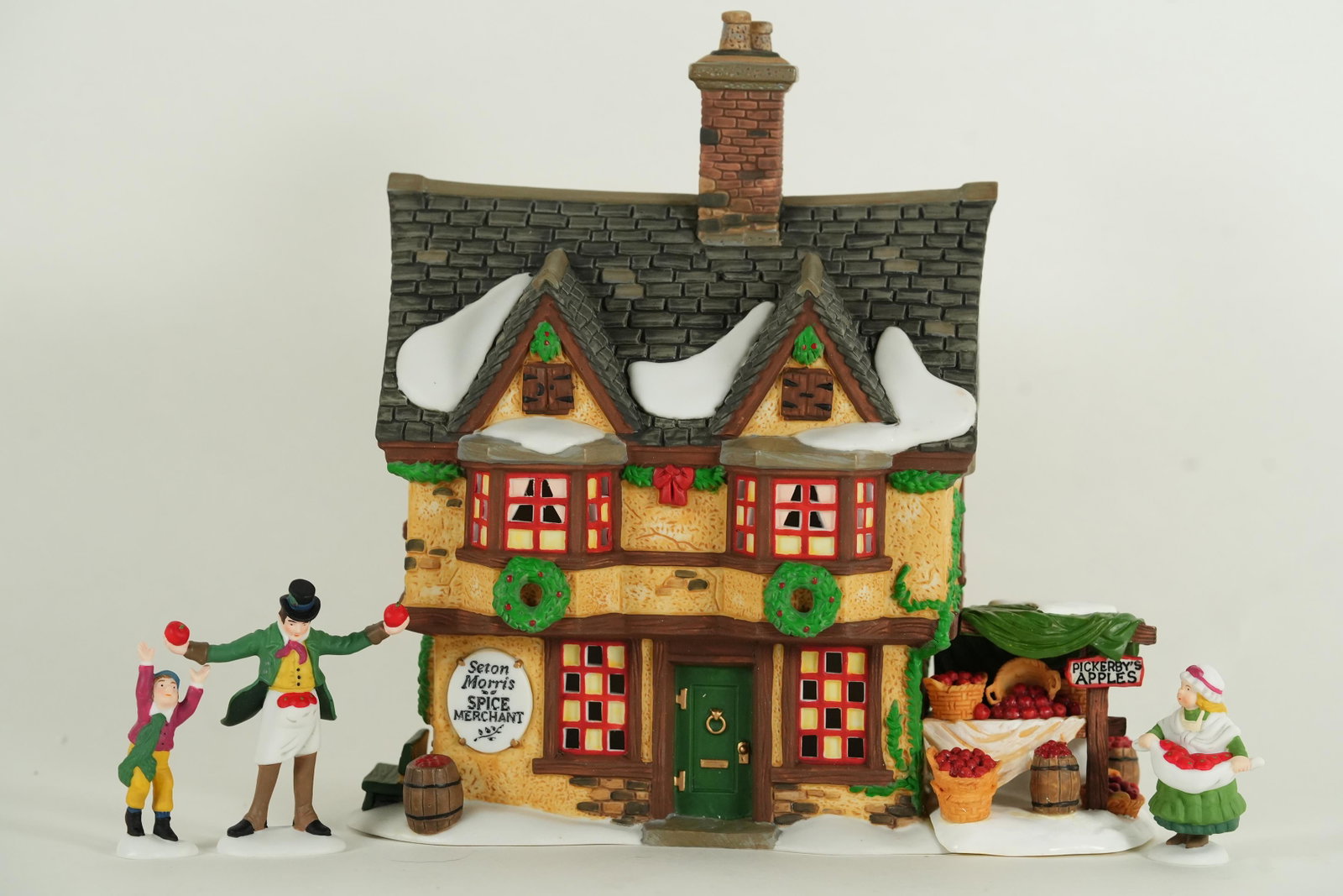 Dept. 56 Morris Spice Merchant: Department 56. Seton Morris Spice Merchant figurine, comes with original box. H: 8" x W: 7.9."