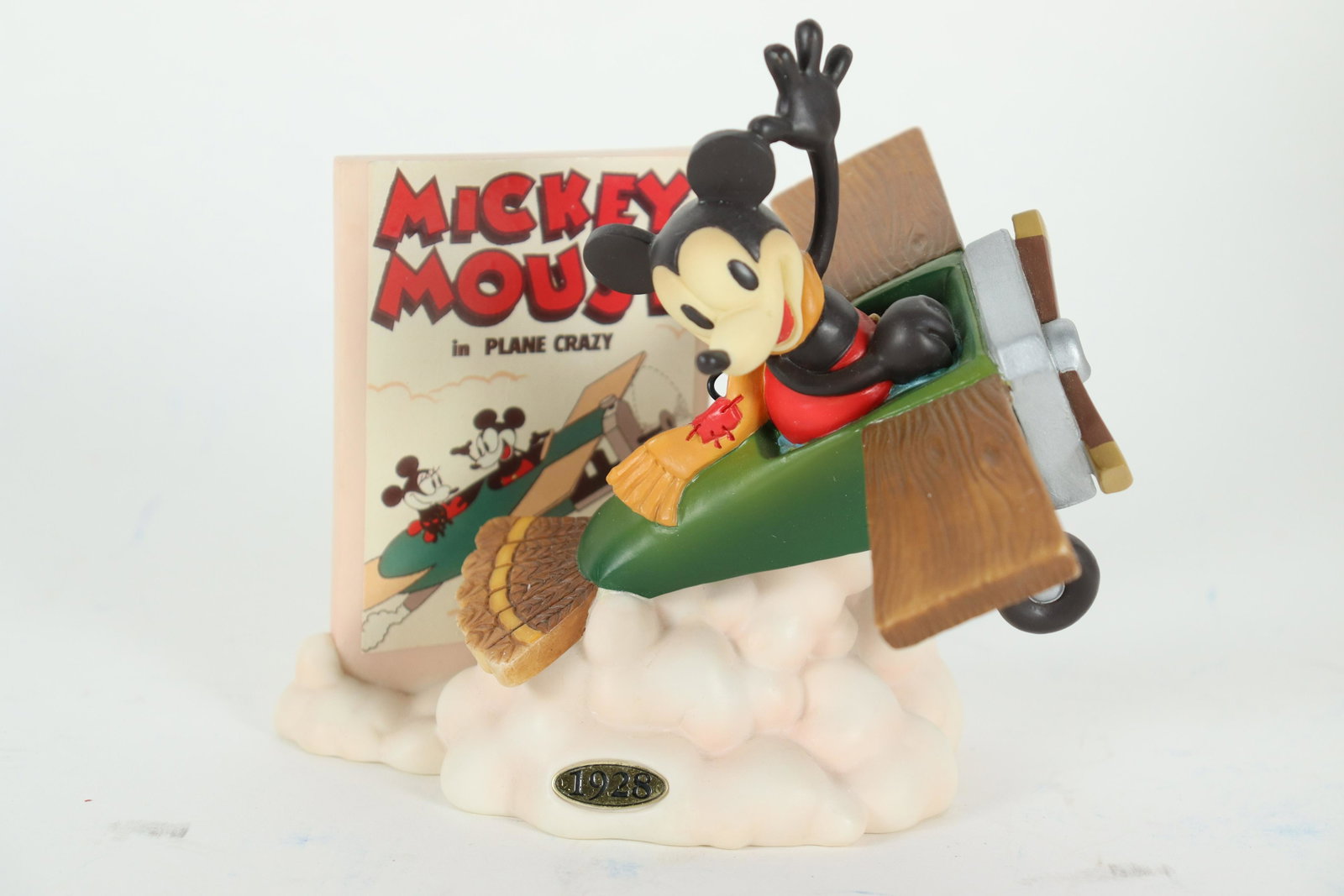 Mickey Collection figurine: Best of Mickey Collection, Plane Crazy, 1928. Dated 12-31-1998. Comes with original booklet and original box. H: 6" x W: 4."