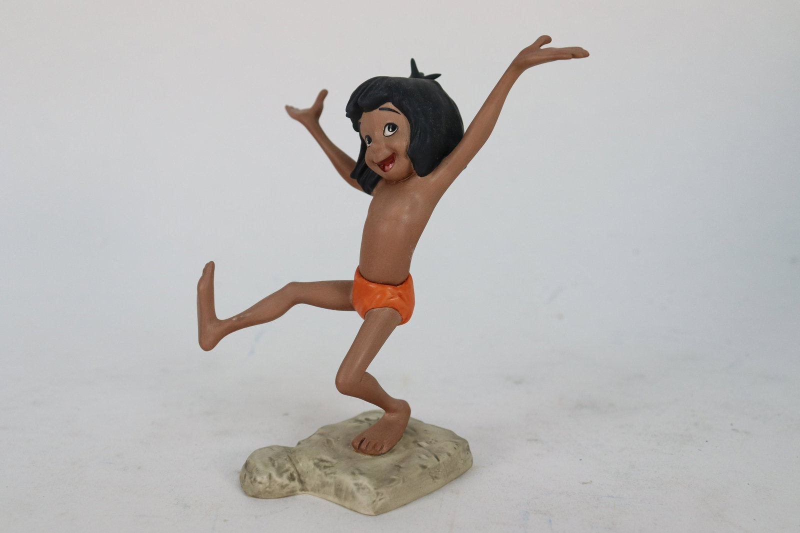 Mowgli WDC figurine: Mowgli from The Jungle Book WDC figurine. Comes with COA and original box. H: 5" x W: 4."