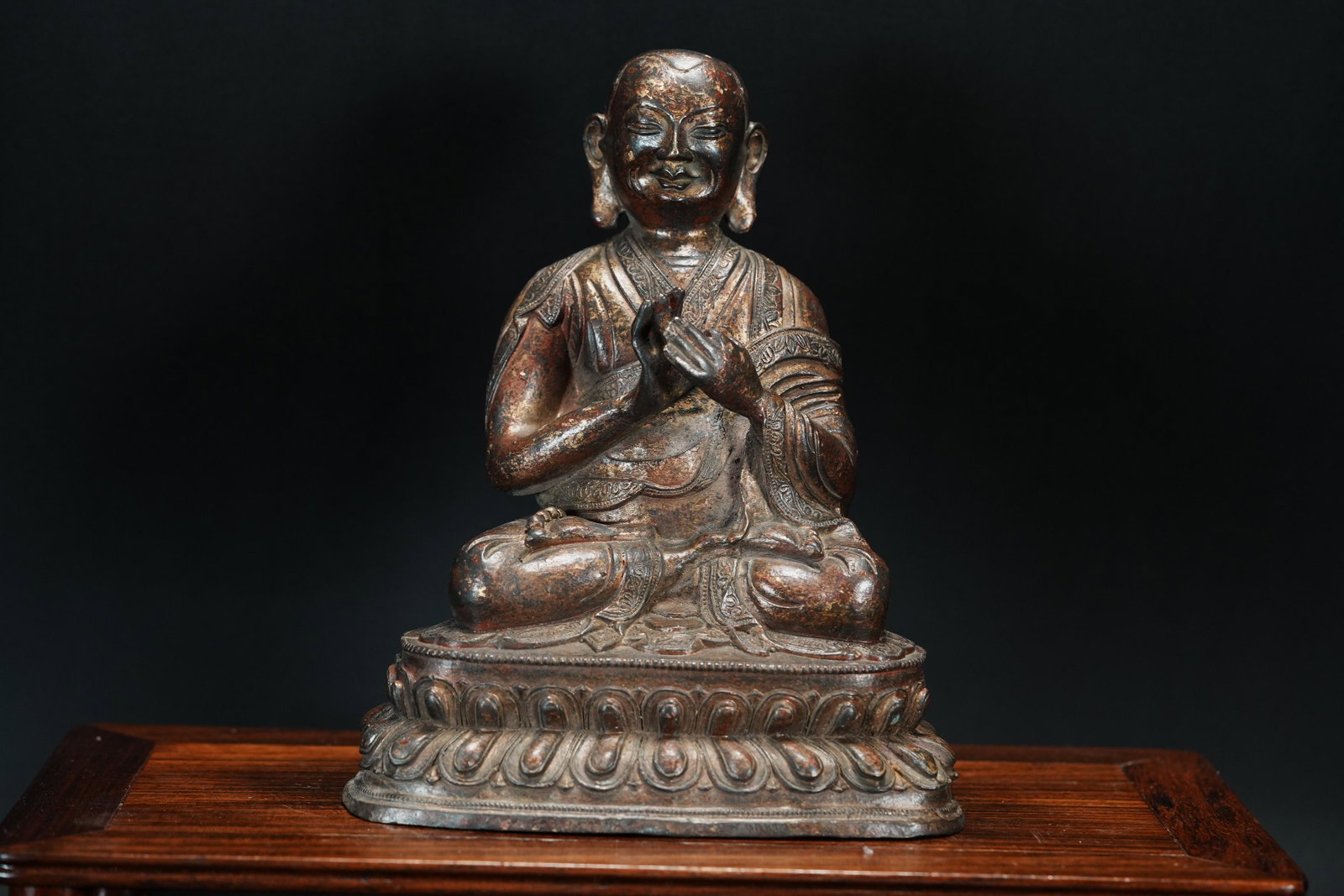 Tibetan bronze buddha: Tibetan bronze finely carved seated buddha. H: 8" x W: 6."