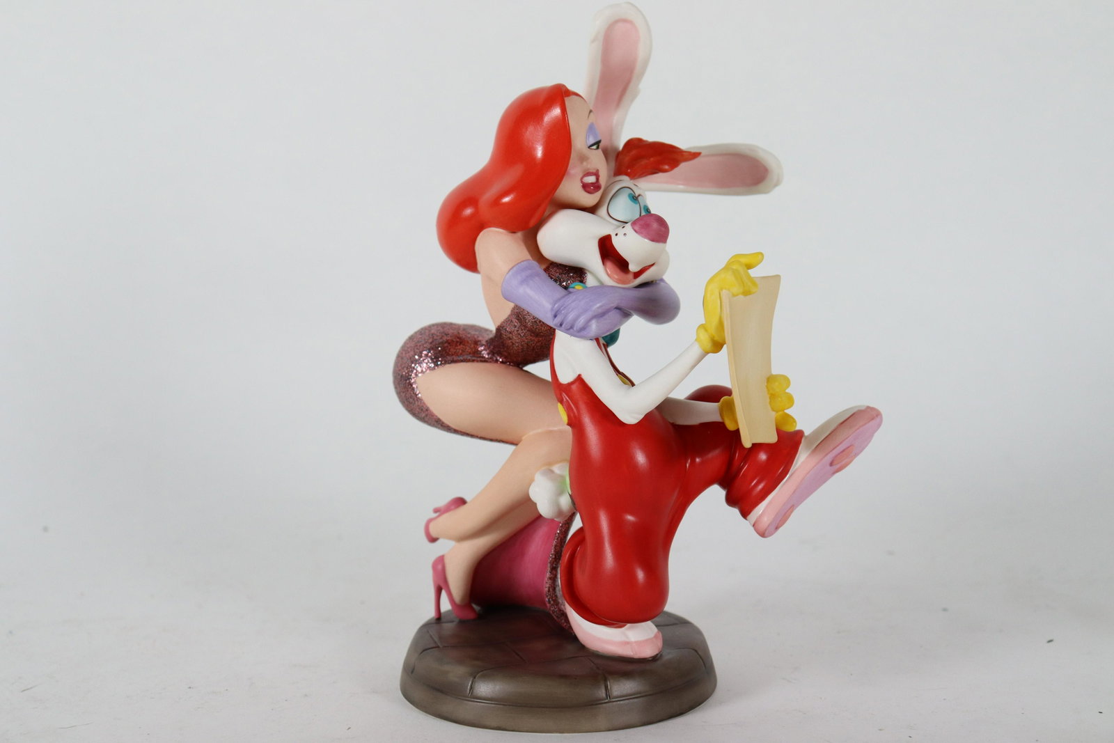 Jessica WDC figurine: Roger and Jessica Rabbit fine WDC figurine. Comes with original box and COA. A rare collection numbered 2,993 of 7,500. H: 7.5" x W: 3.6."