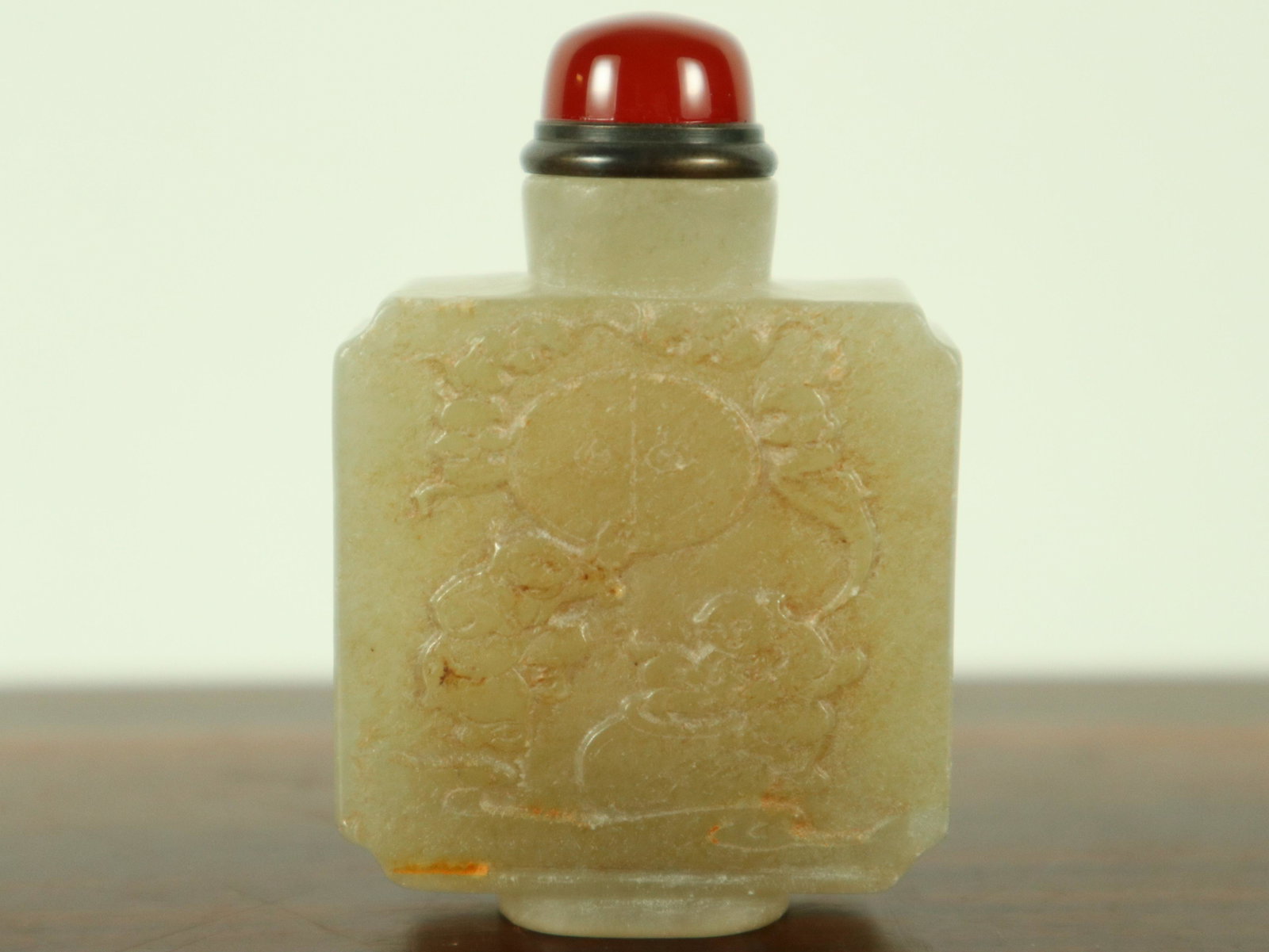 Chinese jade snuff bottle: Chinese jade carved snuff bottle. H: 2.5" x W: 2.1."