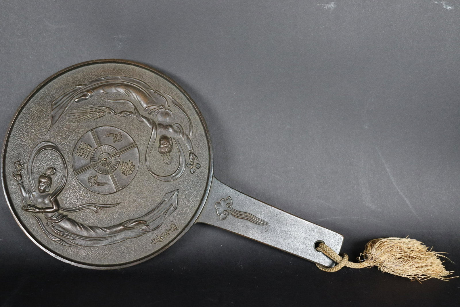 Japanese bronze mirror: Fine Japanese vintage bronze carved mirror. H: 10" x W: 6."