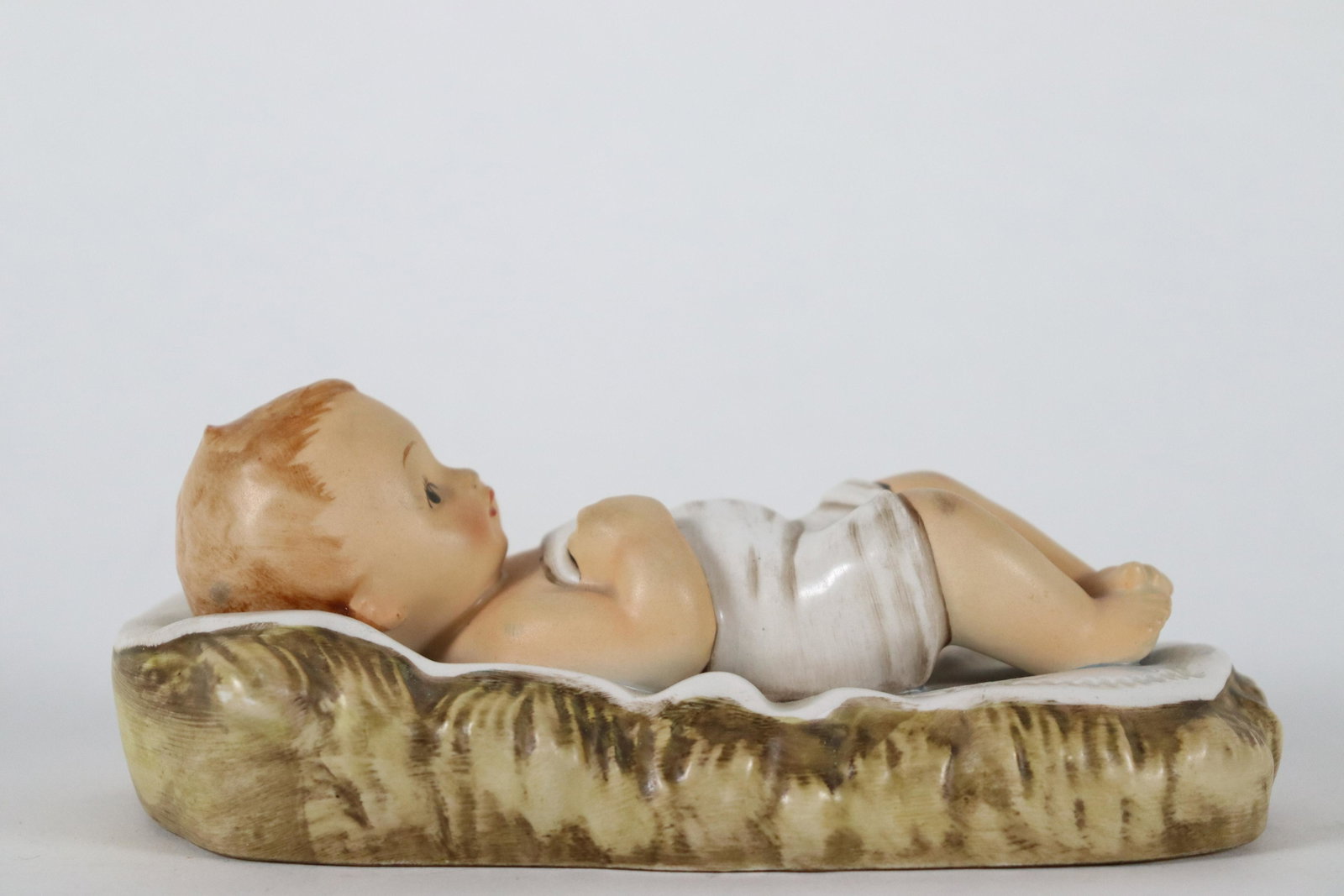 Vintage Hummel doll: Vintage fine Hummel doll, Germany. H: 2.25" x W: 6.25."