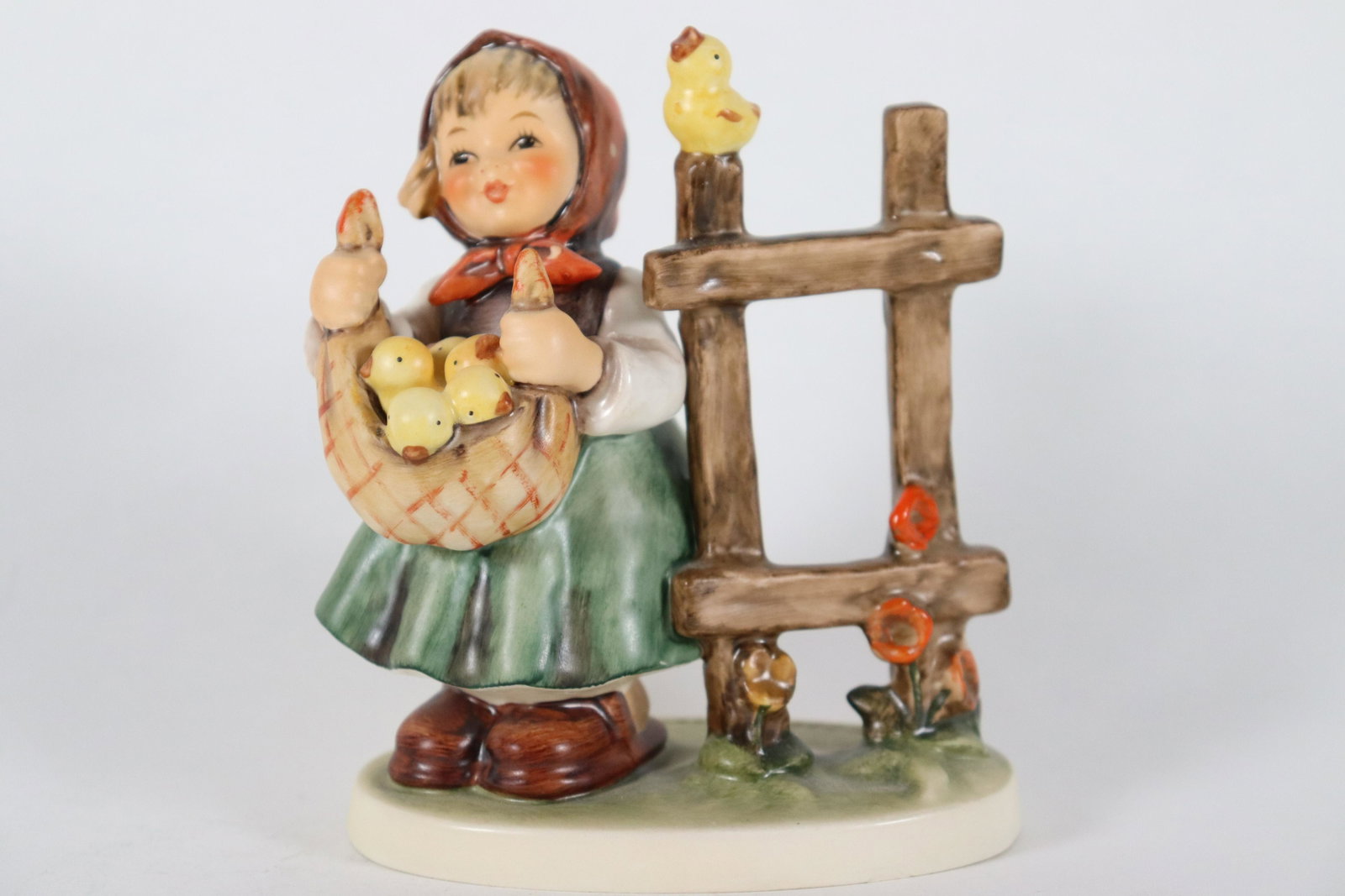Hummel girl figurine: A vintage Hummel girl figurine, dated 1971, W. Germany. Comes with original box and certificate. H: 5" x W: 3.95."