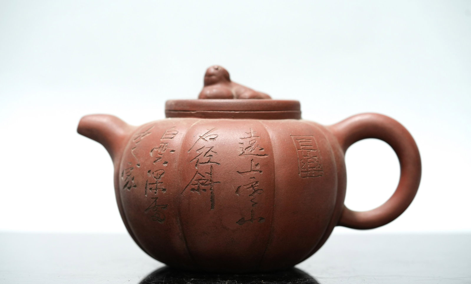 Chinese vintage clay teapot: Chinese vintage clay teapot. H: 4" x W: 7."
