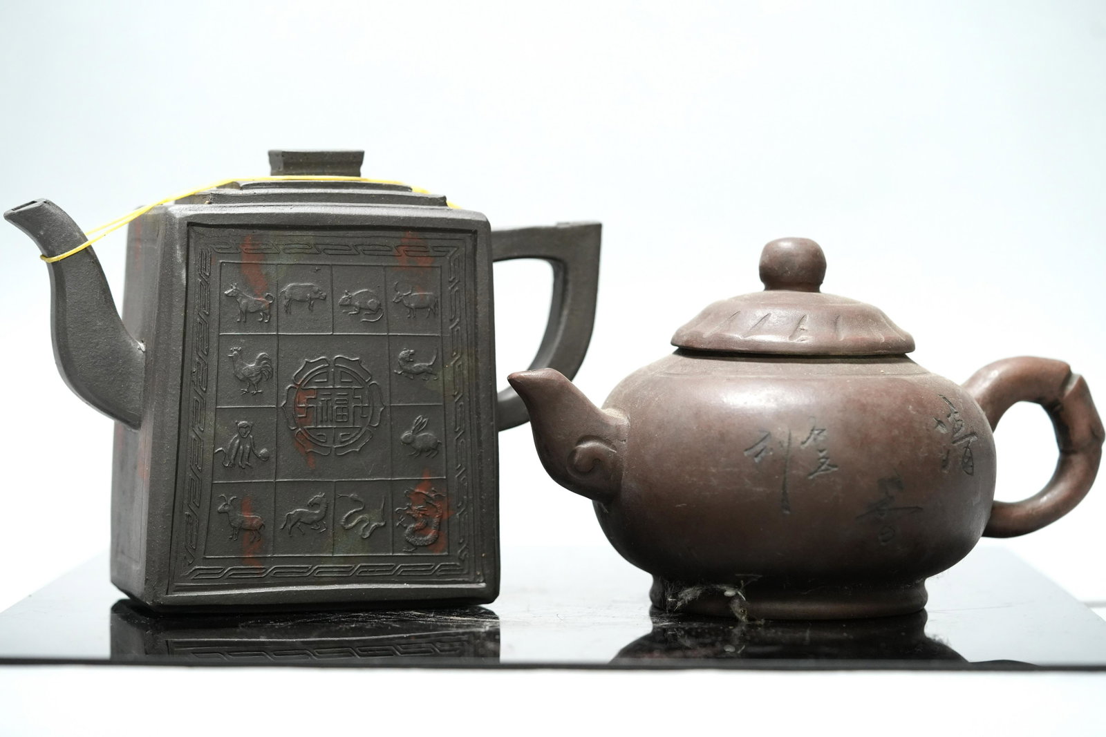 2 pcs Chinese black teapot: 2 pcs Chinese black clay teapot. Largest H: 5" x W: 6.75."