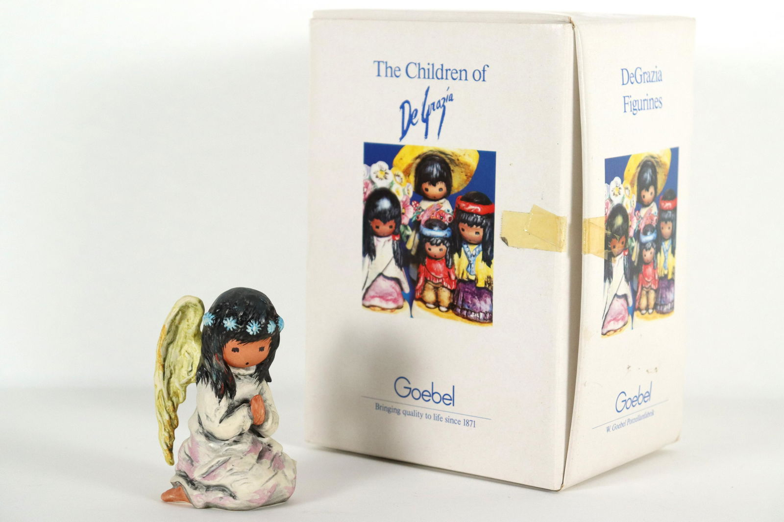 Goebel DeGrazia figurine: Goebel DeGrazia fine figurine, dated 1990, comes with original box. H: 3.75" x W: 2.75."
