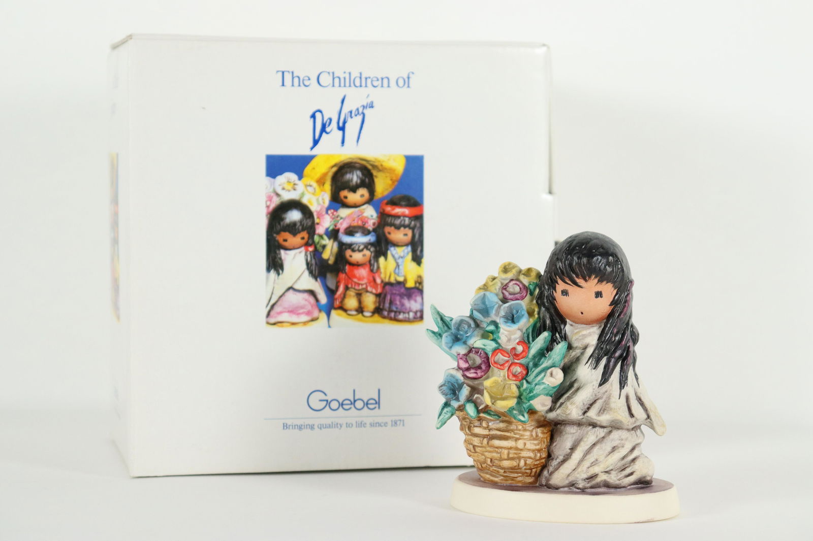 Goebel DeGraia figurine: Goebel DeGrazia fine figurine, Fllowers for Mother. H: 4.5" x W: 3.65."