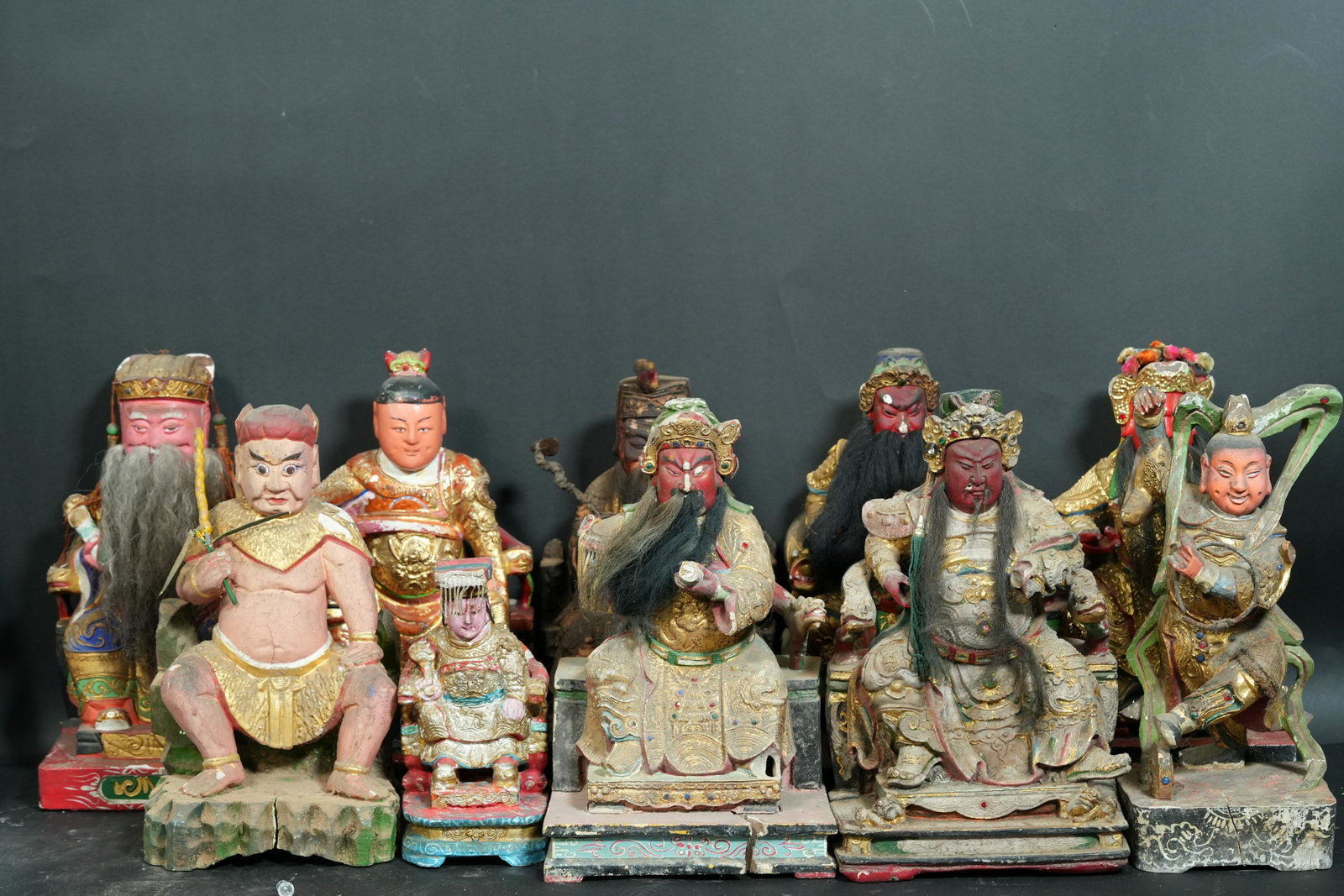 10 pcs Chinese camphor wood statues: 10 pcs Chinese vintage camphor wood staues. Condition selling it as is, there are missing hands and chip on the statues. Largest H: 10.5" x W: 6.25."