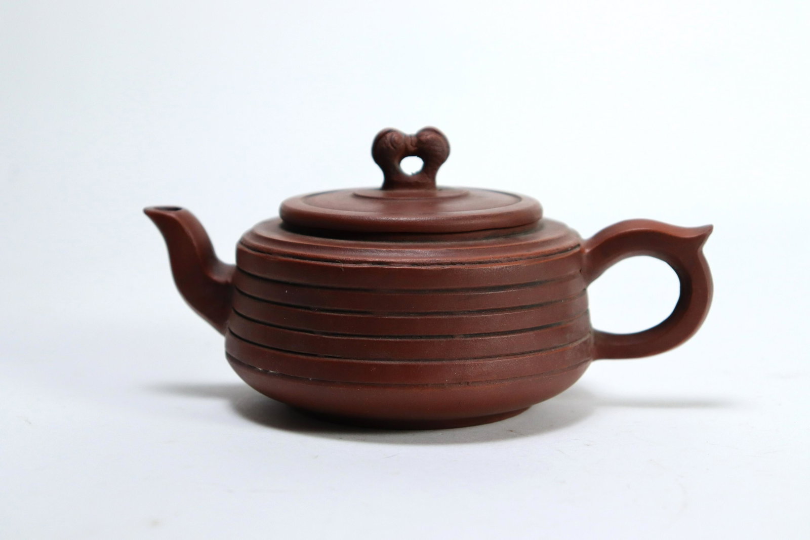 Chinese vintage clay teapot: Chinese vintage clay teapot. H: 3.25" x W: 6.5."