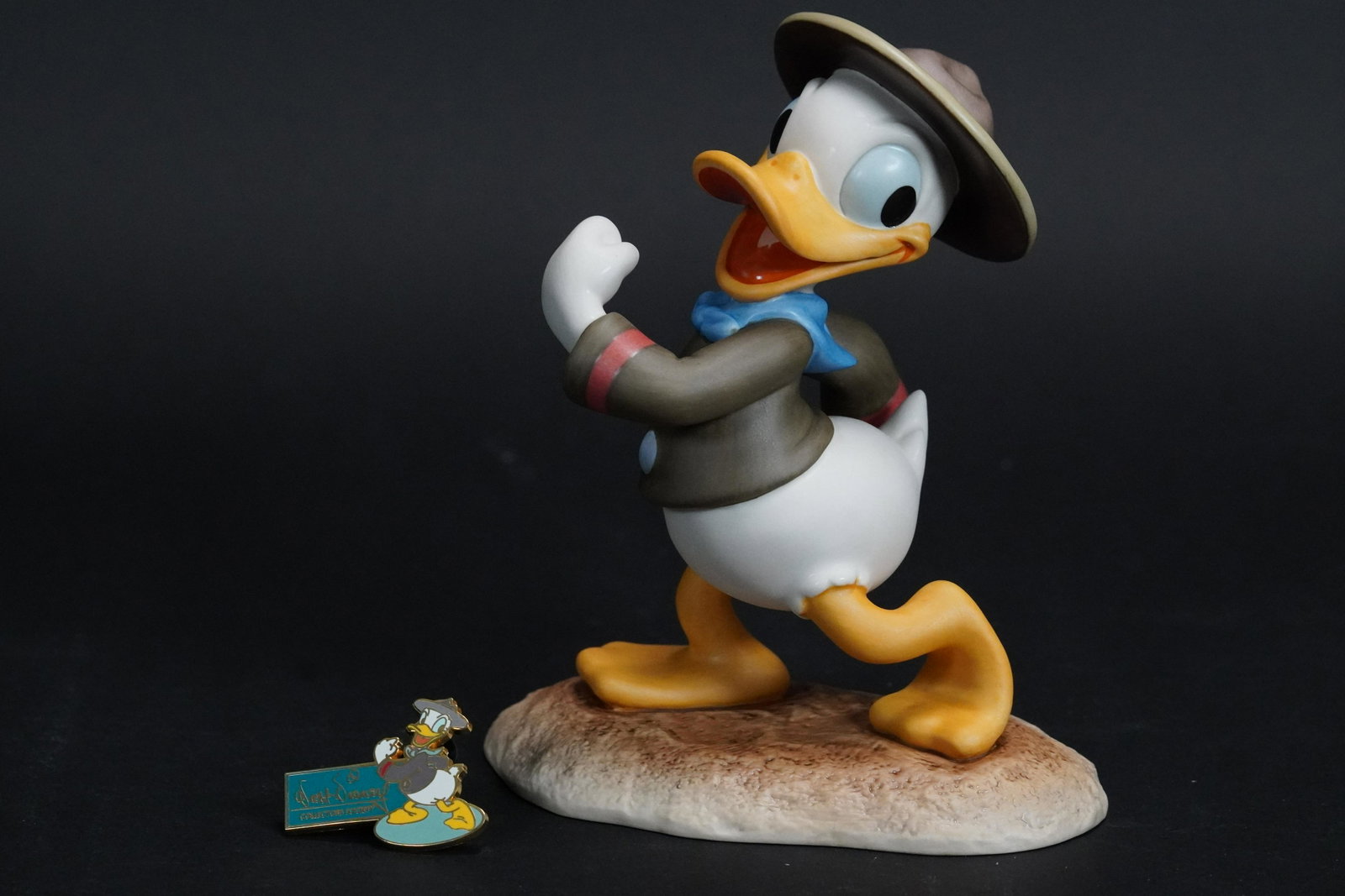 WDC Donald Duck figurine: WDC Donald Duck fine figurine. Comes with COA and original box. H: 4.7" x W: 4."