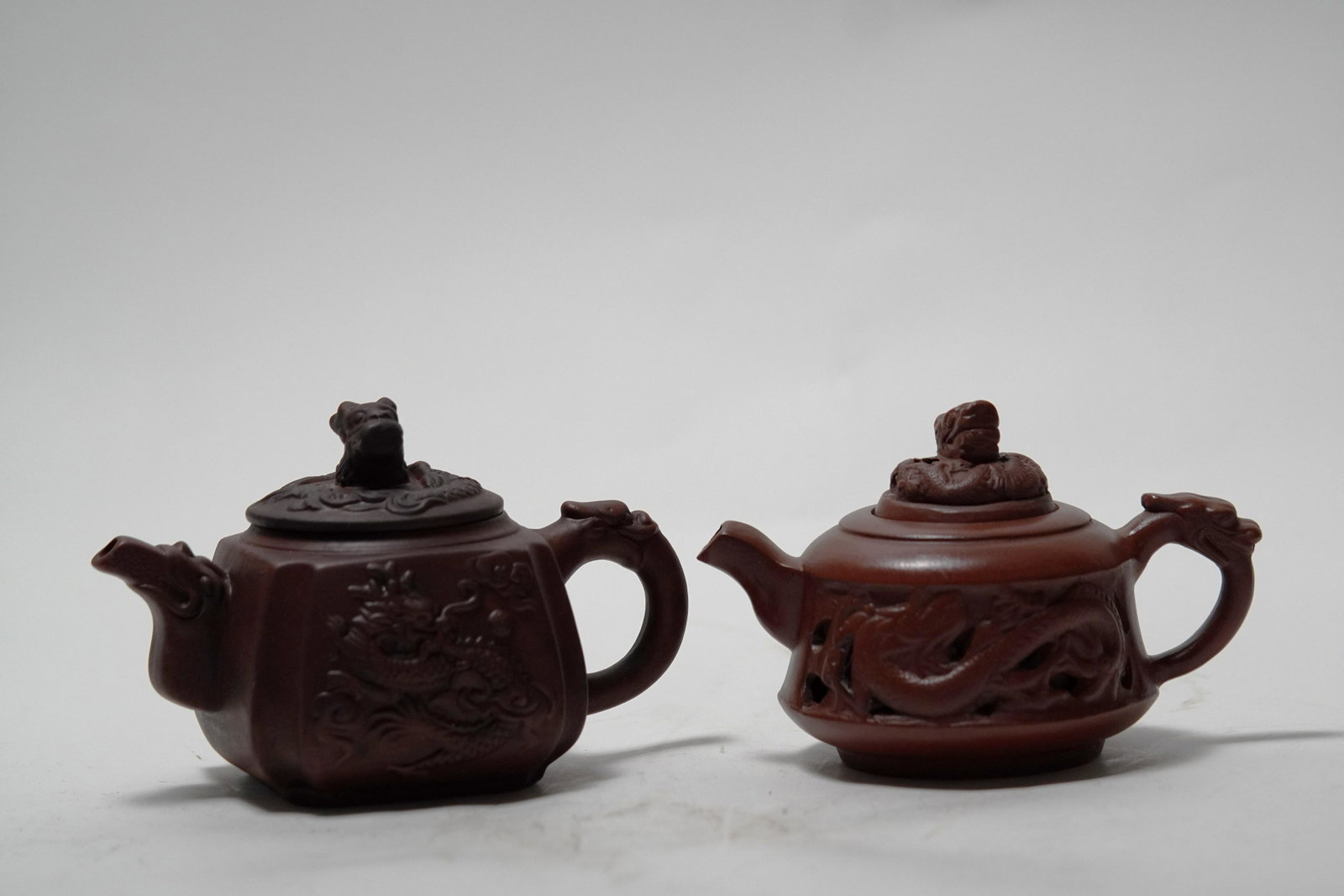 2 pcs Chinese clay teapot: 2 pcs Chinese fine clay teapot. Largest H: 4.75" x W: 8."