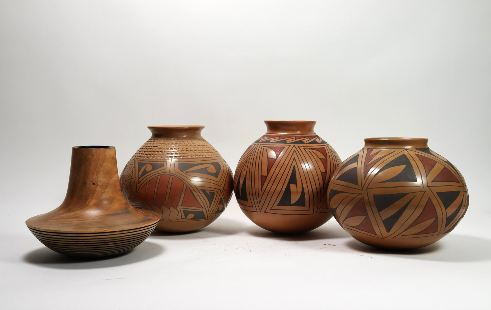 Lots of Indian pots: Lots of Indian pots, signed by artist, please refer to detail photos. Largest H: 11" x W: 4.5."