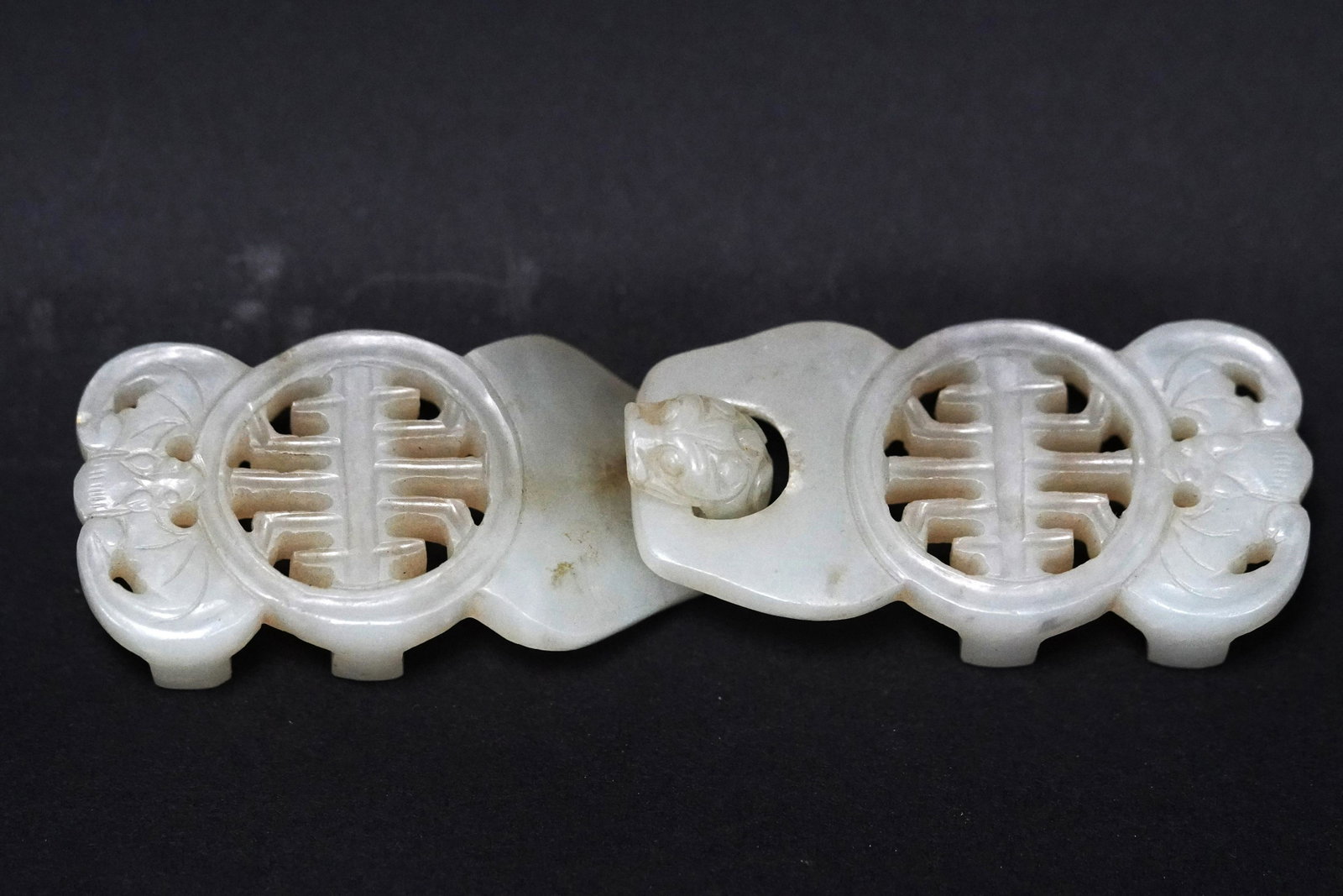Chinese fine jade buckle: Chinese fine jade carved buckle. H: 4" x W: 1.25."