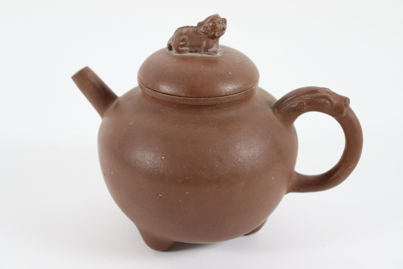 Chinese fine clay teapot: Chinese fine clay teapot, bottom has carved maker's mark. H: 5.5" x W: 6.5."