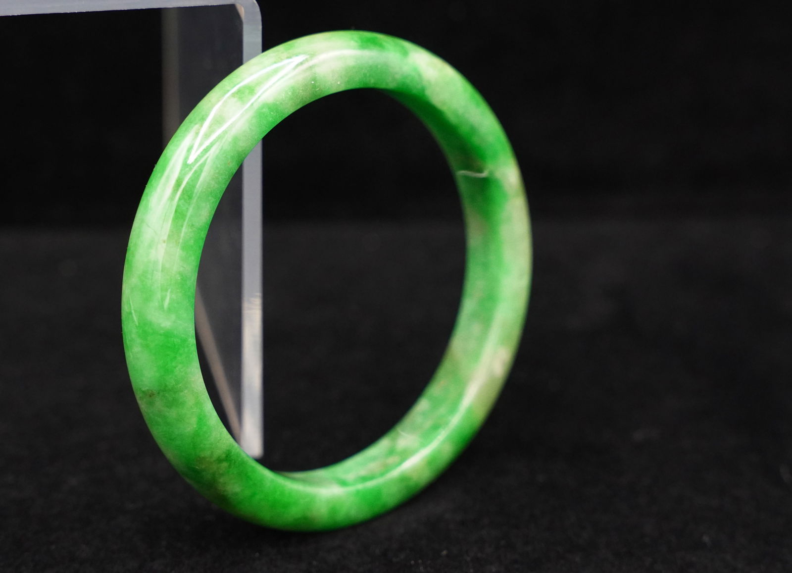 Chinese apple green bangle: Chinese apple green jadeite bangle.