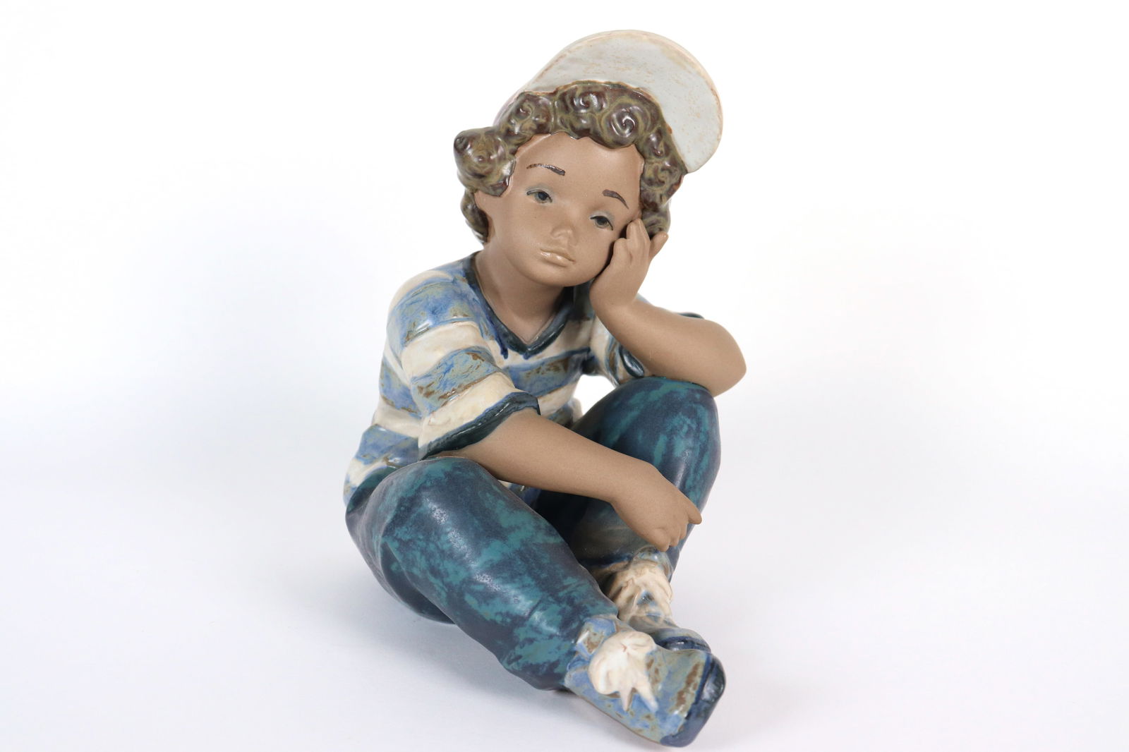 A Lladro boiy figure (1 of 5)
