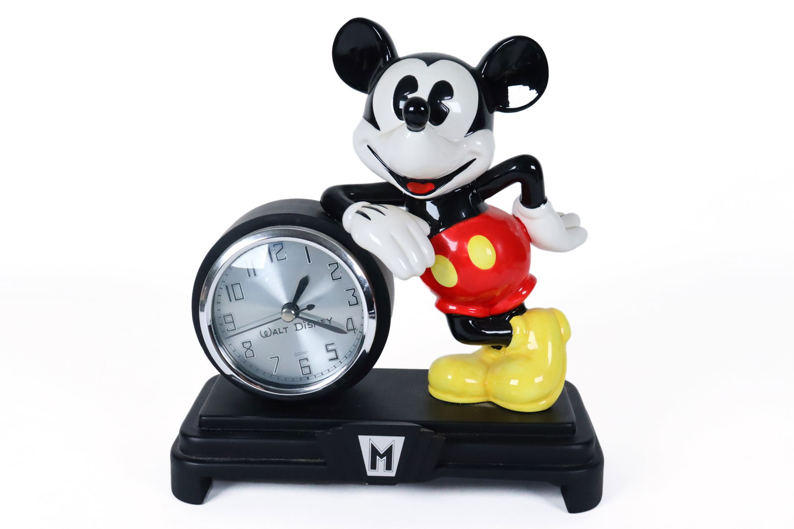 A Mickey Mouse clock: A Mickey Mouse clock, condition selling it as is. H: 9.5" x W: 8.25."
