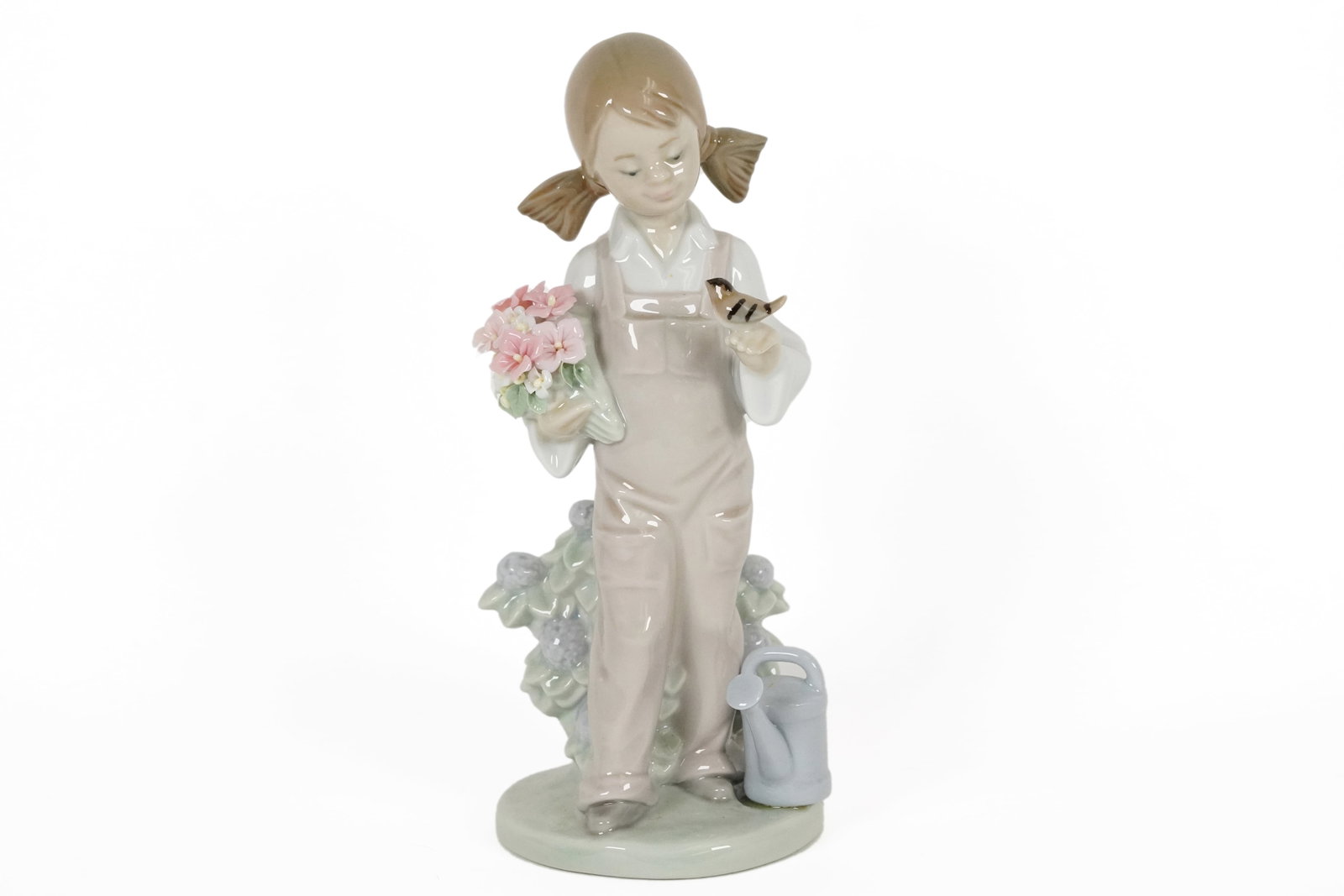 Lladro girl with flower: Lladro girl with flower figurine. H: 7.5" x W: 3."